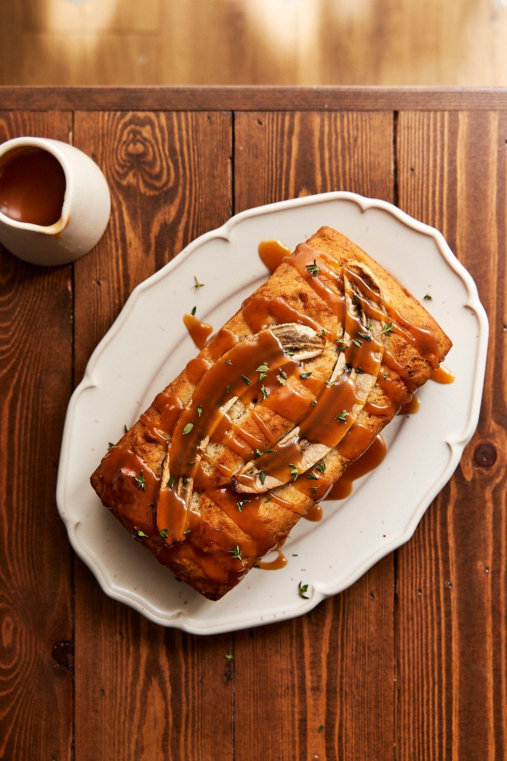 Banana Thyme Caramel Loaf on a plate with Caramel Drizzle