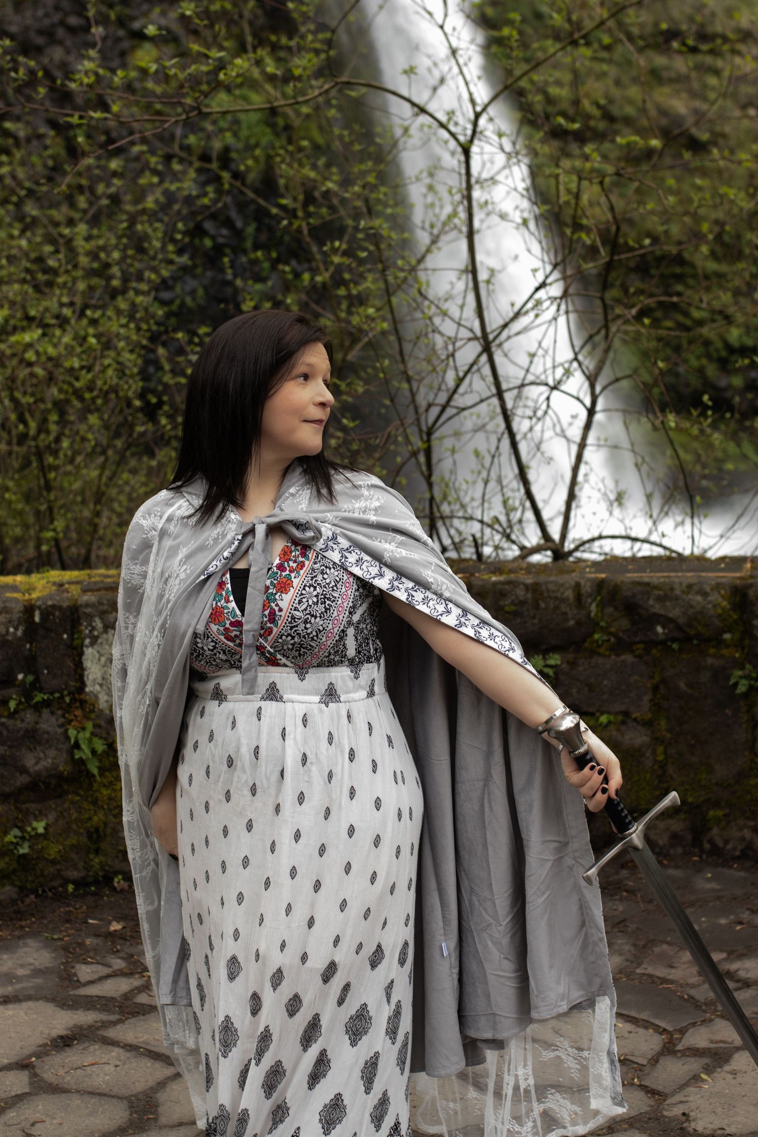 Dark fantasy portrait at Pacific Northwest waterfall
