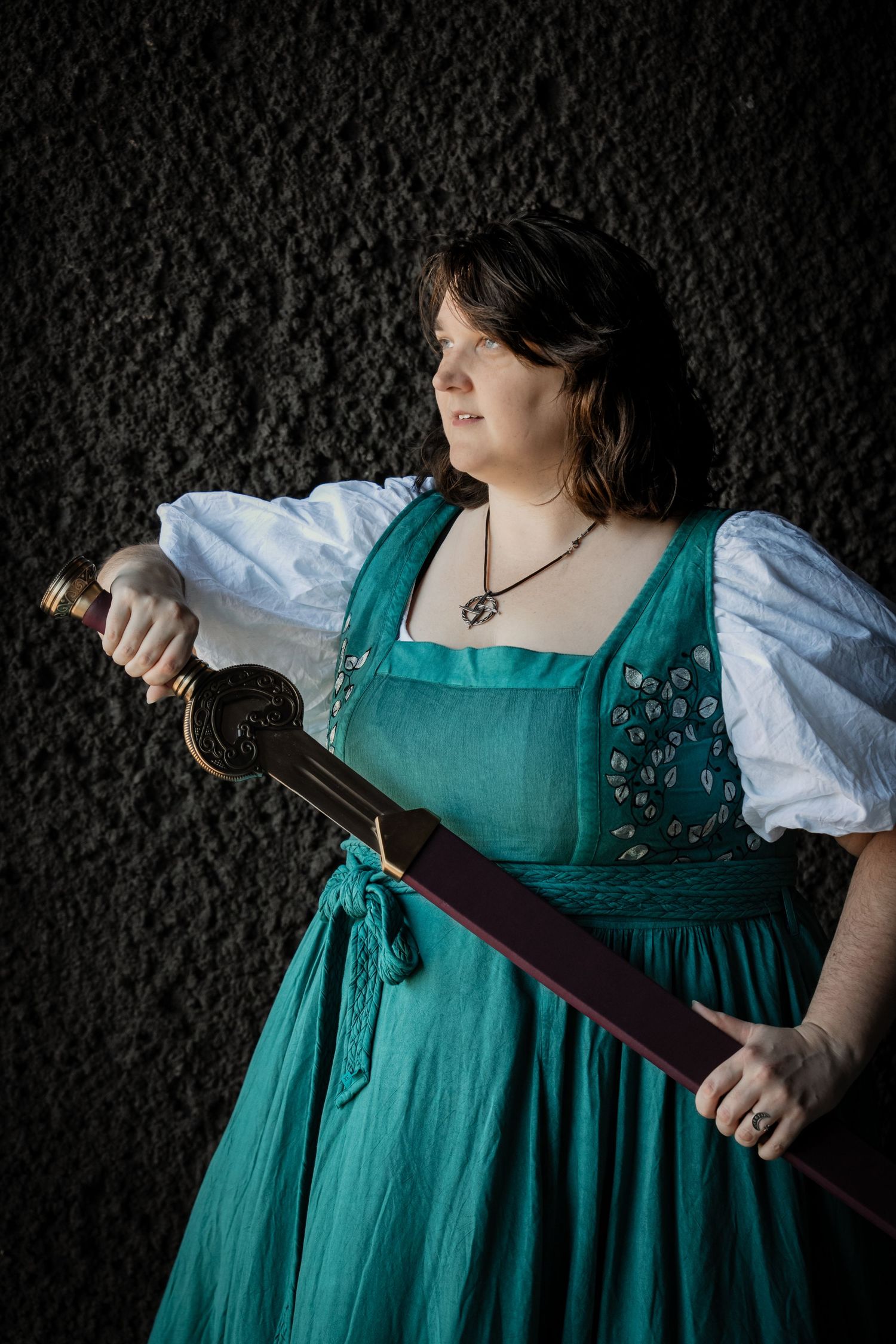 Fantasy portrait with sword in Pacific Northwest forest