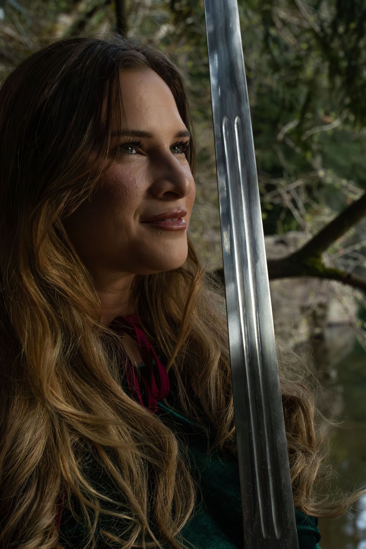 Fantasy portrait with sword in Pacific Northwest forest