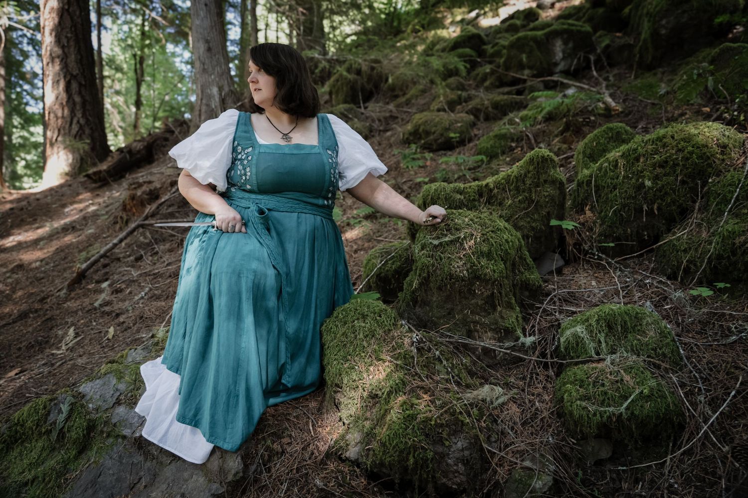 Fantasy portrait with sword in Pacific Northwest forest