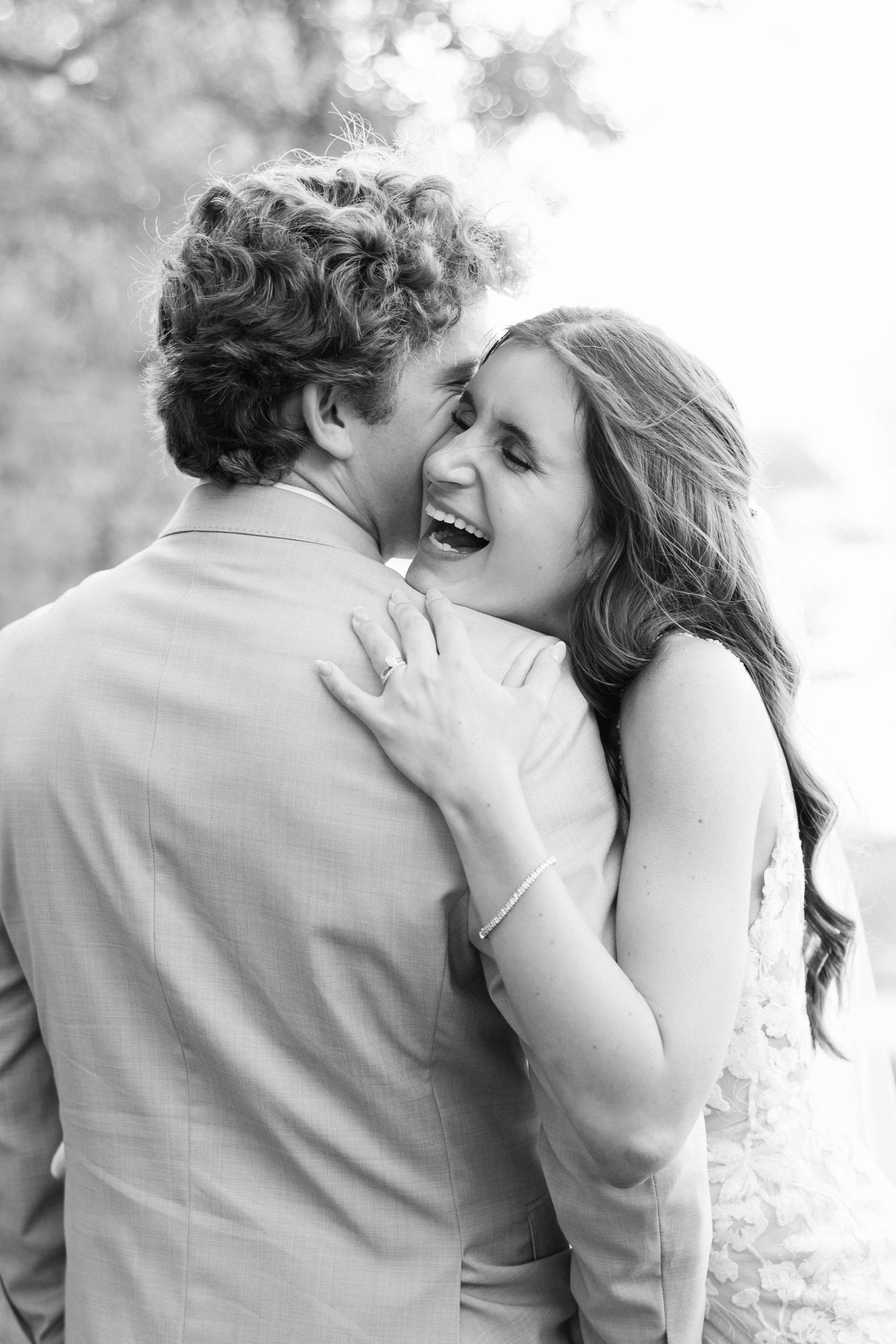 Black and white photo sequence capturing a romantic moment between newlyweds.