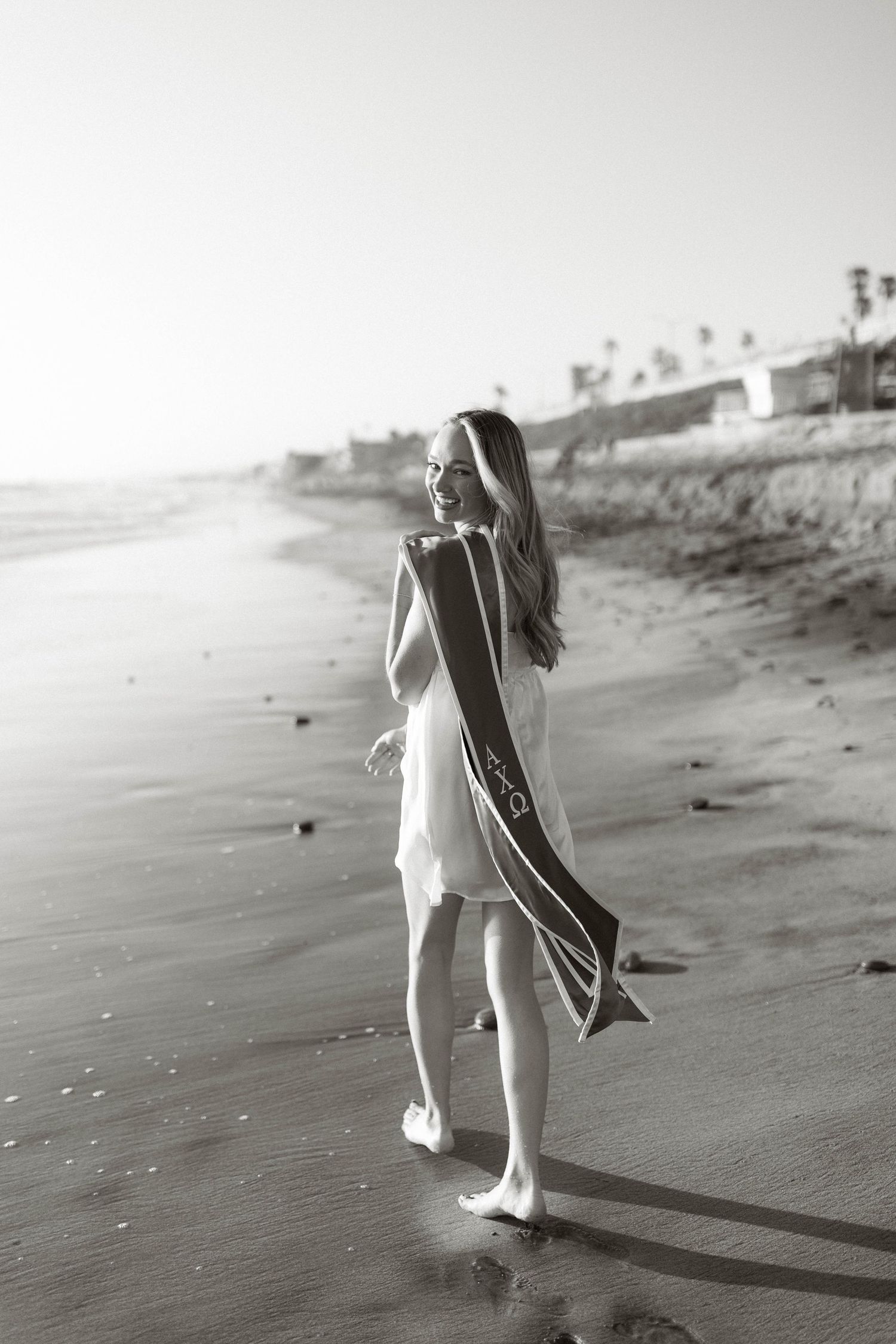 Black and white beach photos showing silhouette walking along shoreline.