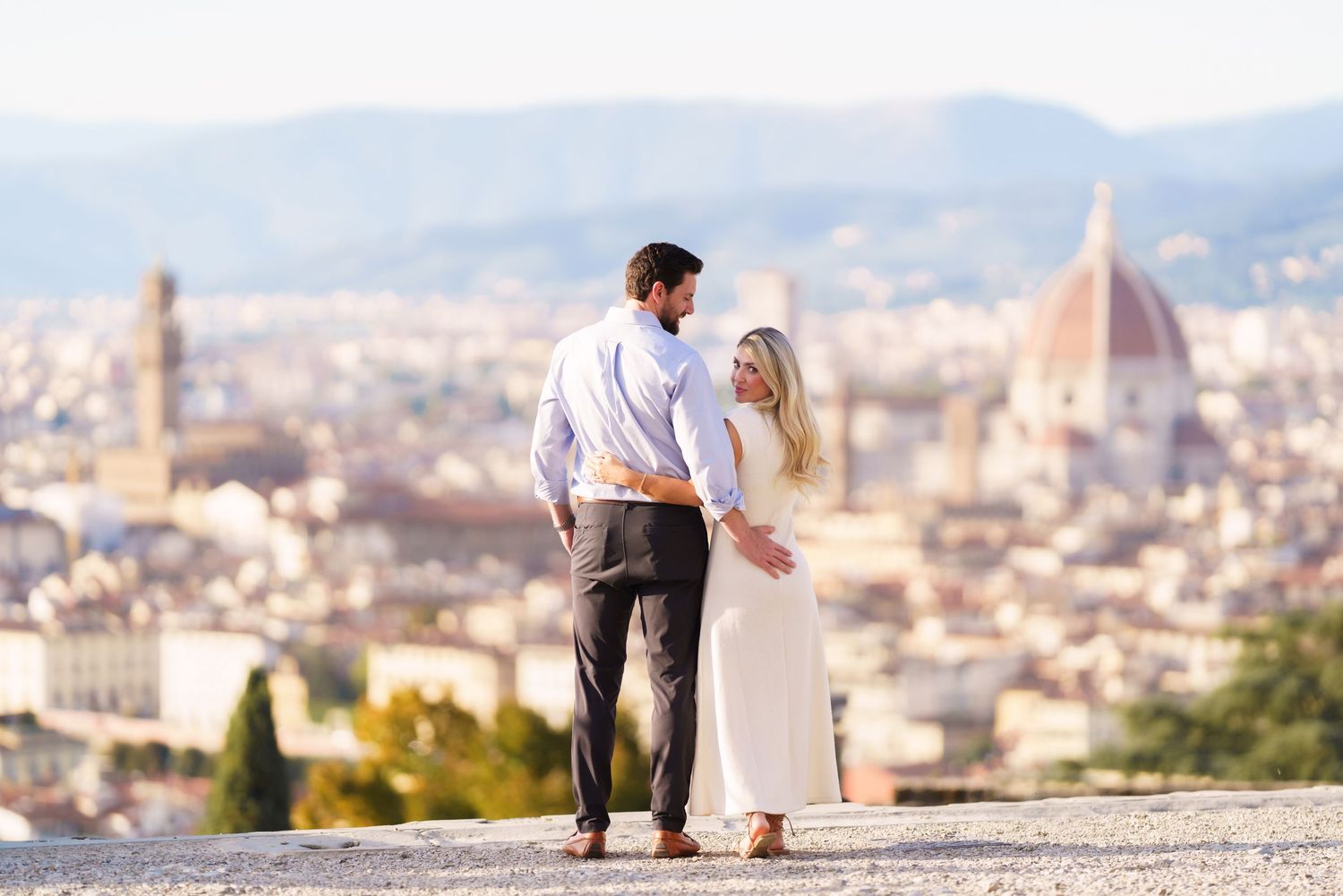 A panoramic view of Florence, Italy with the iconic Duomo cathedral and cityscape visible in the distance.