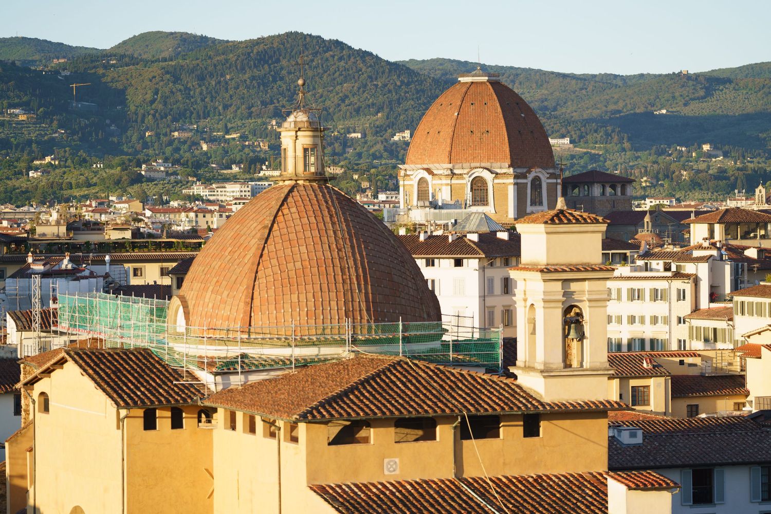 Iconic terracotta dome of Florence's Duomo cathedral rises above the city's historic rooftops.