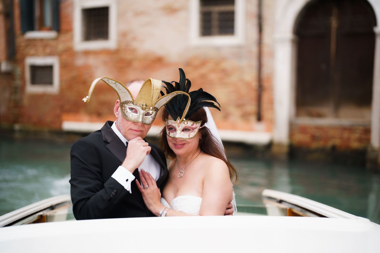 A romantic moment captured in a boat on a Venetian canal.