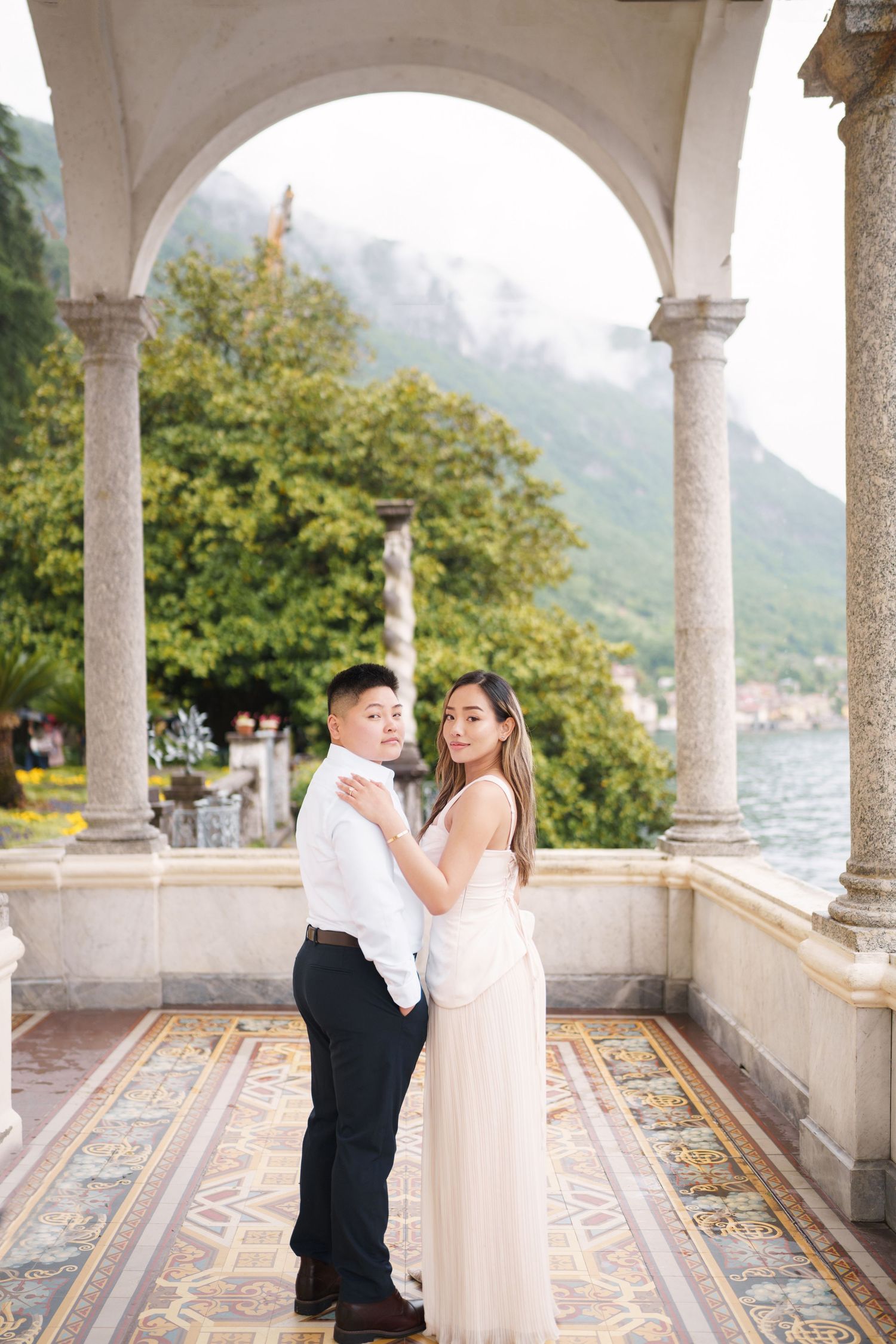 Lake Como proposal photographer capturing surprise engagement at Villa Monastero in Varenna
