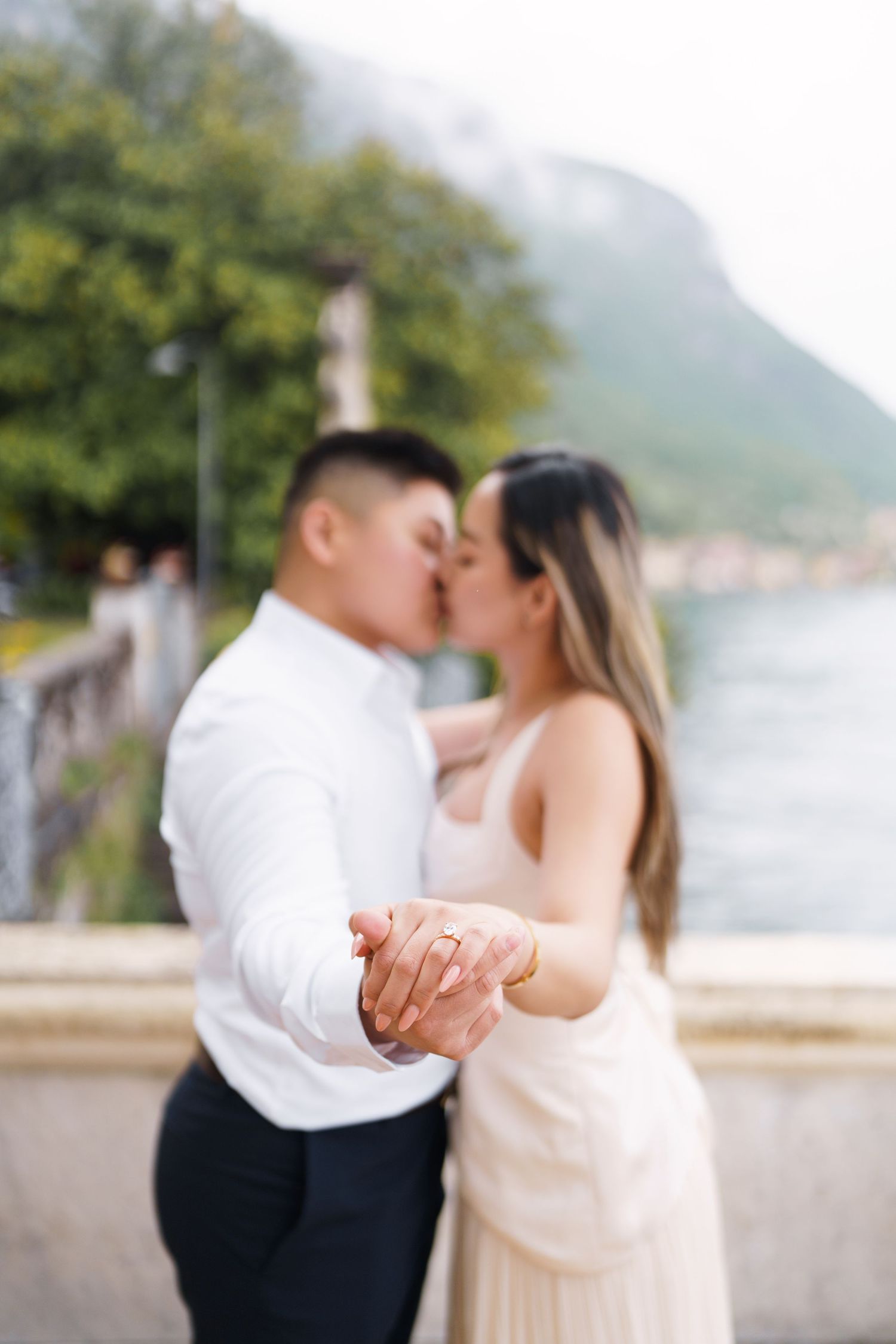 Lake Como proposal photographer capturing surprise engagement at Villa Monastero in Varenna