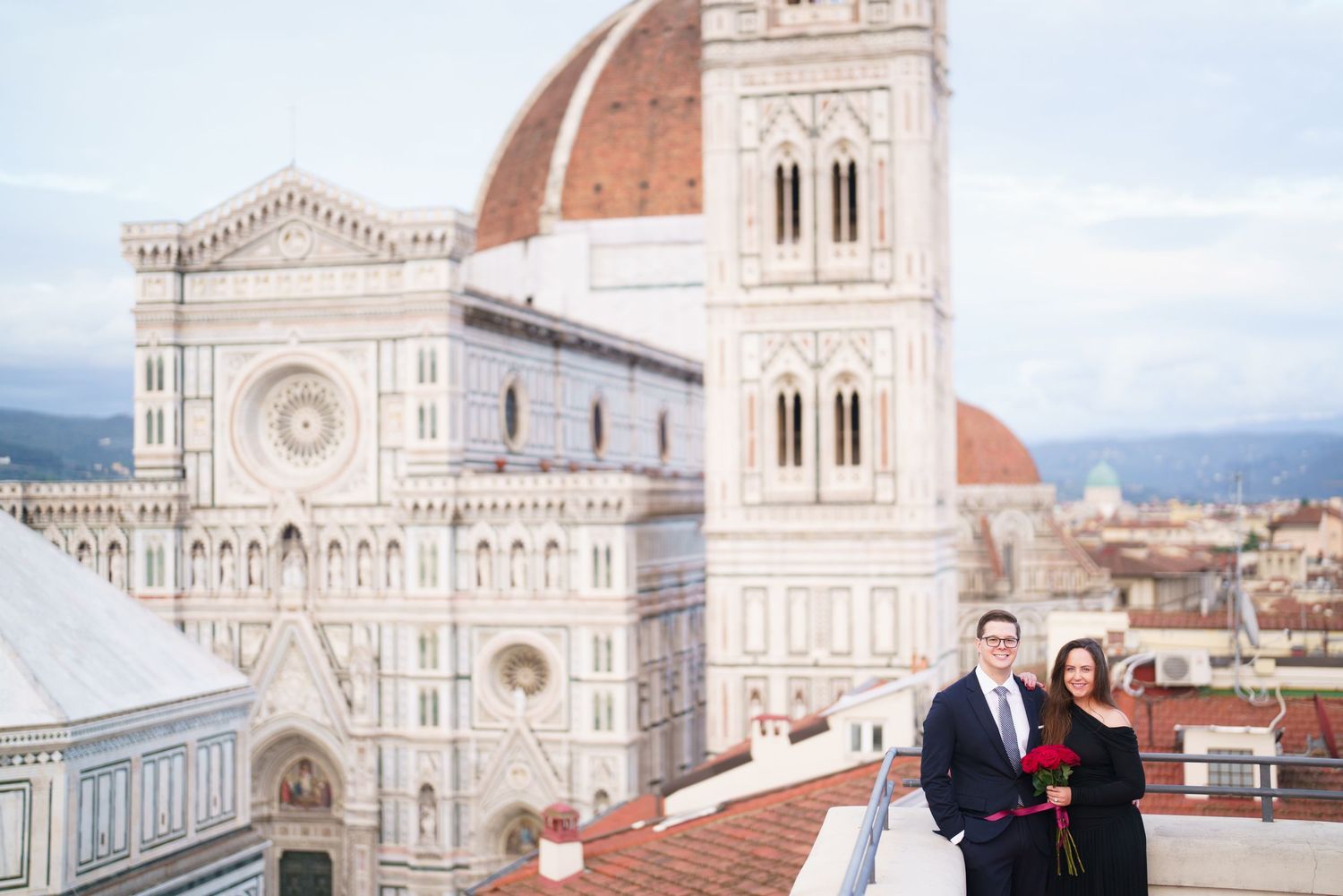 Scenic view of Florence Cathedral's iconic dome and architecture against a cloudy sky in Italy.