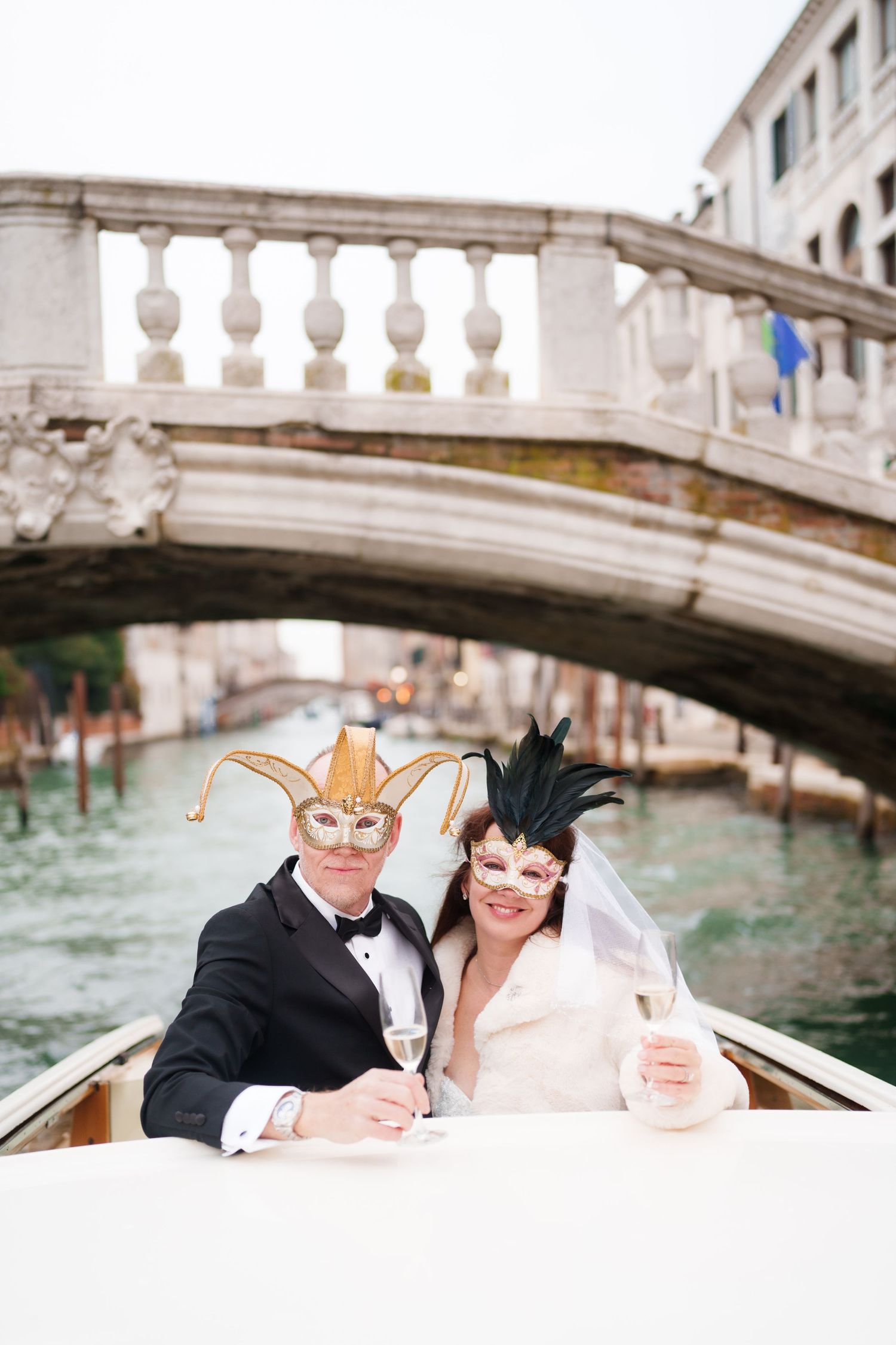 A romantic gondola ride under ornate stone bridges in Venice's picturesque canals.