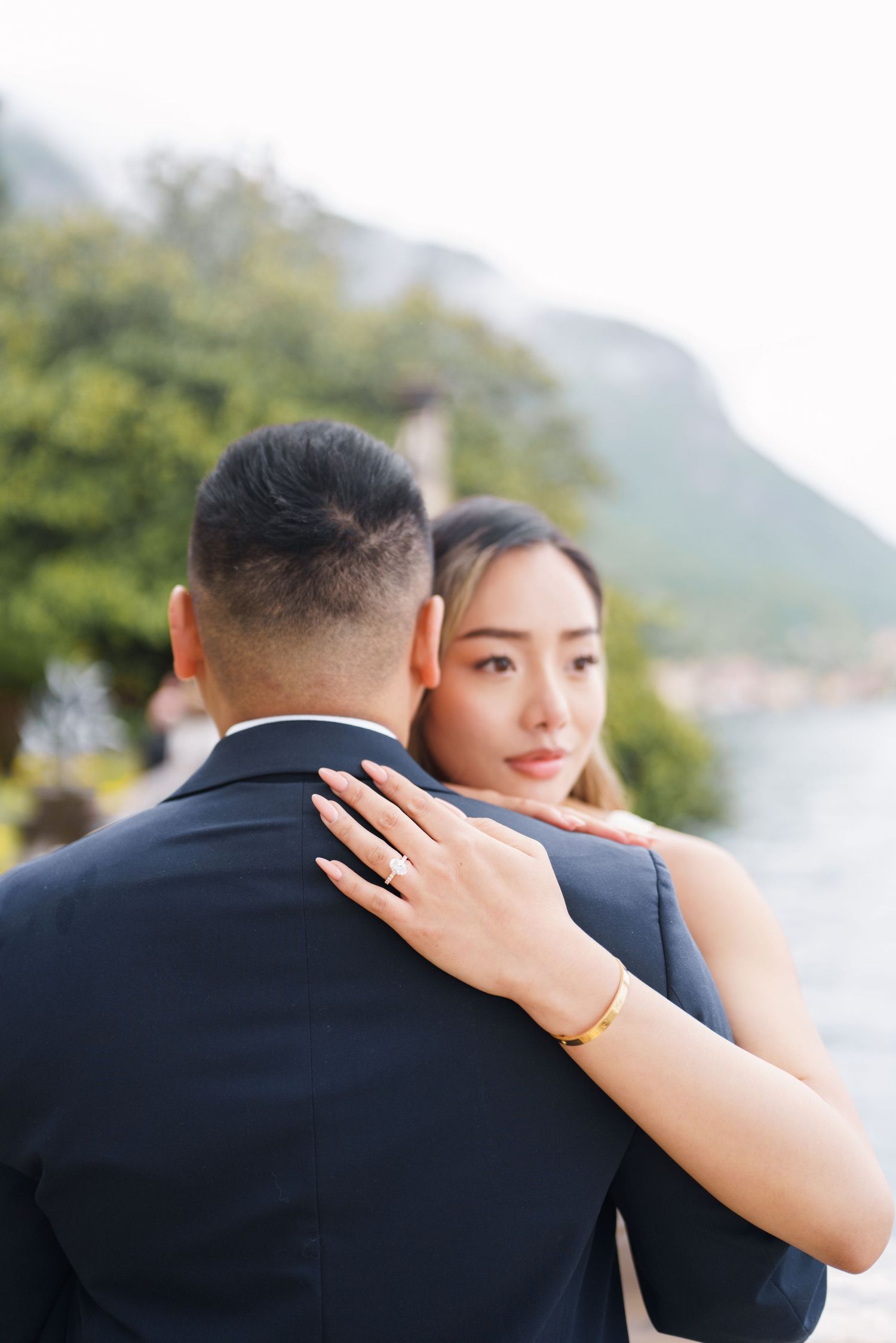 Lake Como proposal photographer capturing surprise engagement at Villa Monastero in Varenna