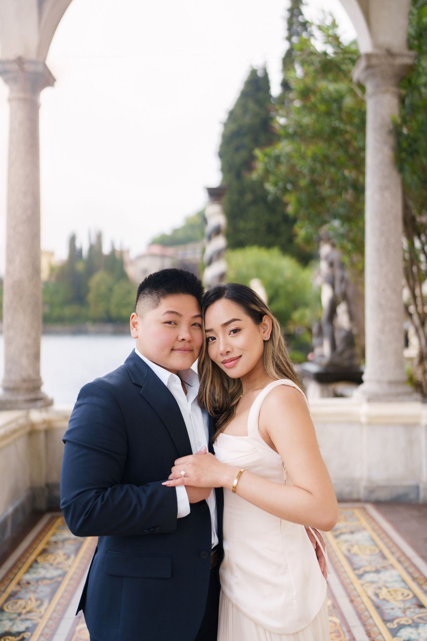 Lake Como proposal photographer capturing surprise engagement at Villa Monastero in Varenna