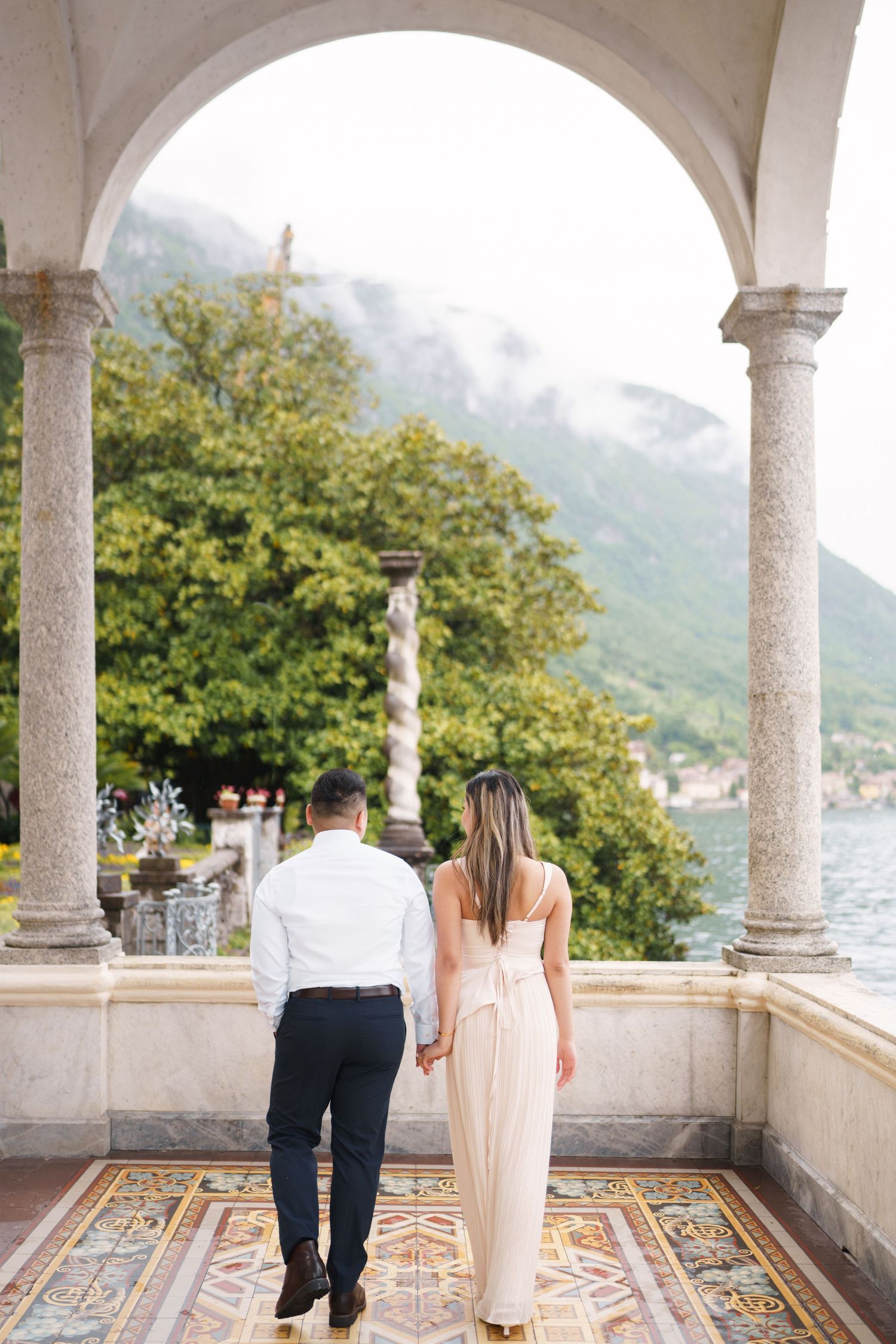 Lake Como proposal photographer capturing surprise engagement at Villa Monastero in Varenna
