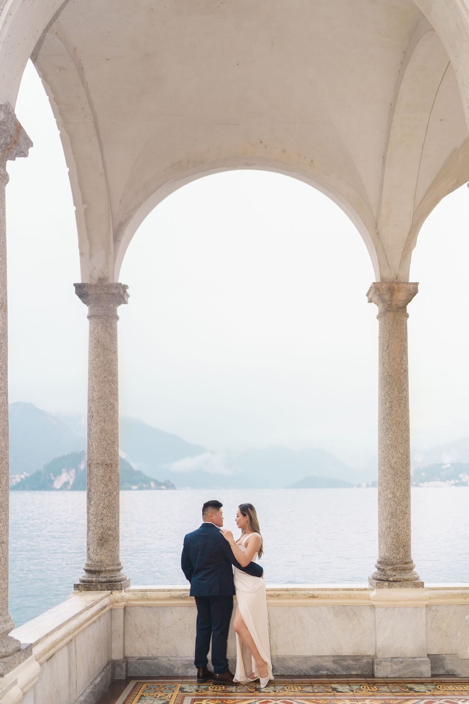 Lake Como proposal photographer capturing surprise engagement at Villa Monastero in Varenna