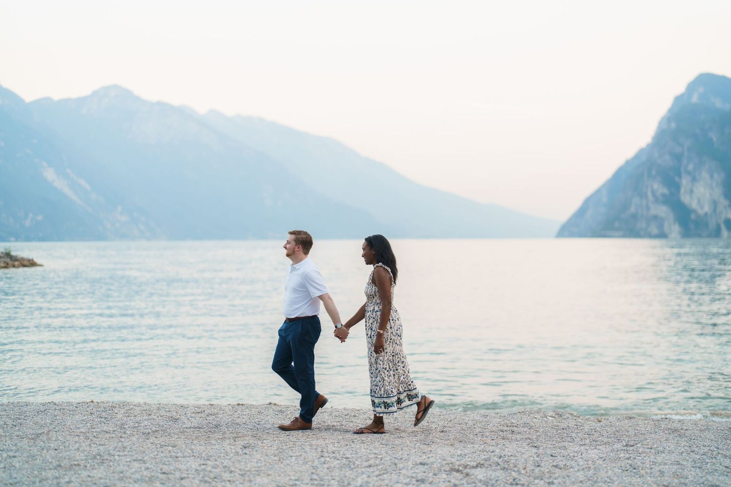 Surprise marriage proposal on one knee overlooking Lake Garda in Riva del Garda, Italy