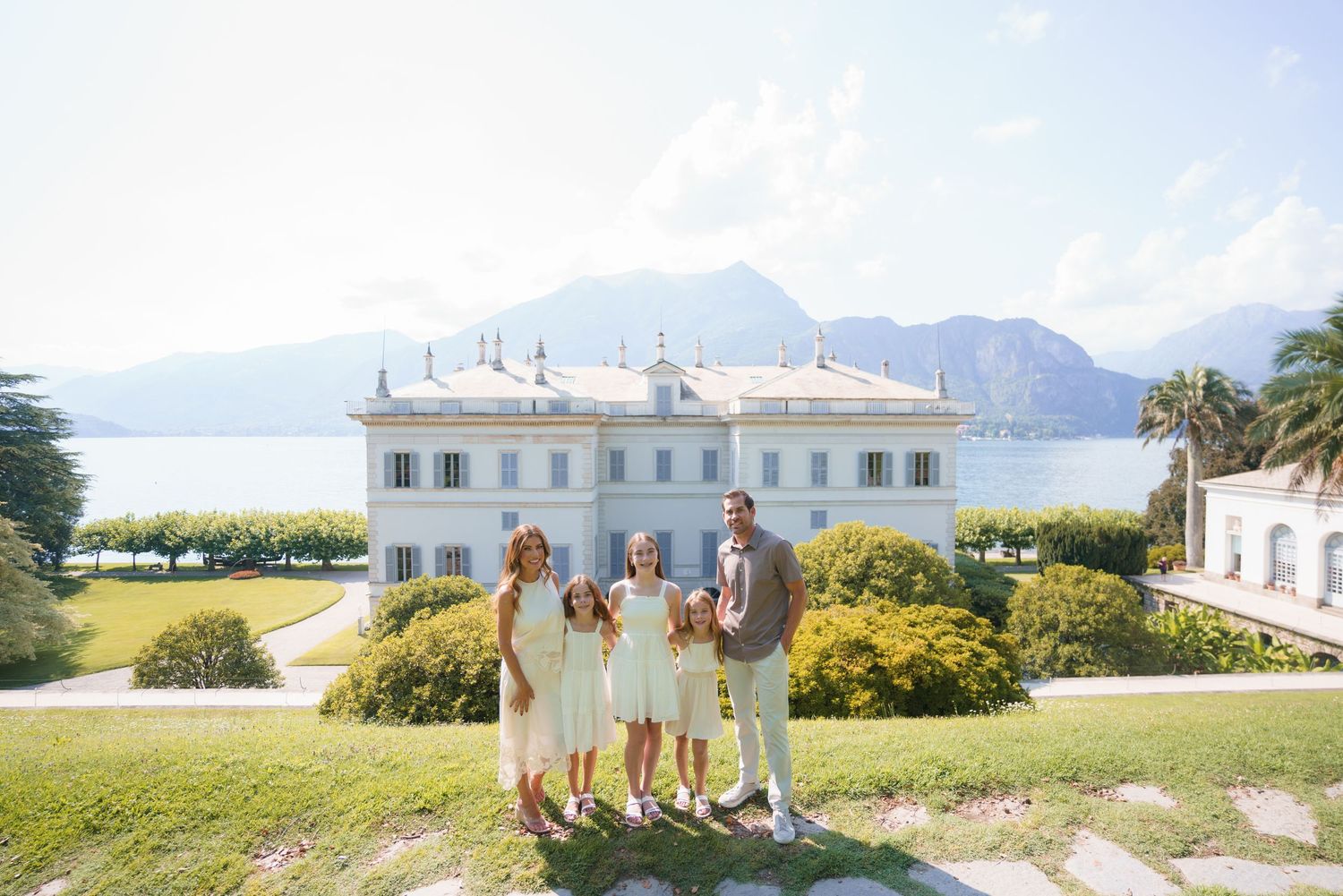 Family portrait at Villa Melzi with Lake Como mountains in Bellagio