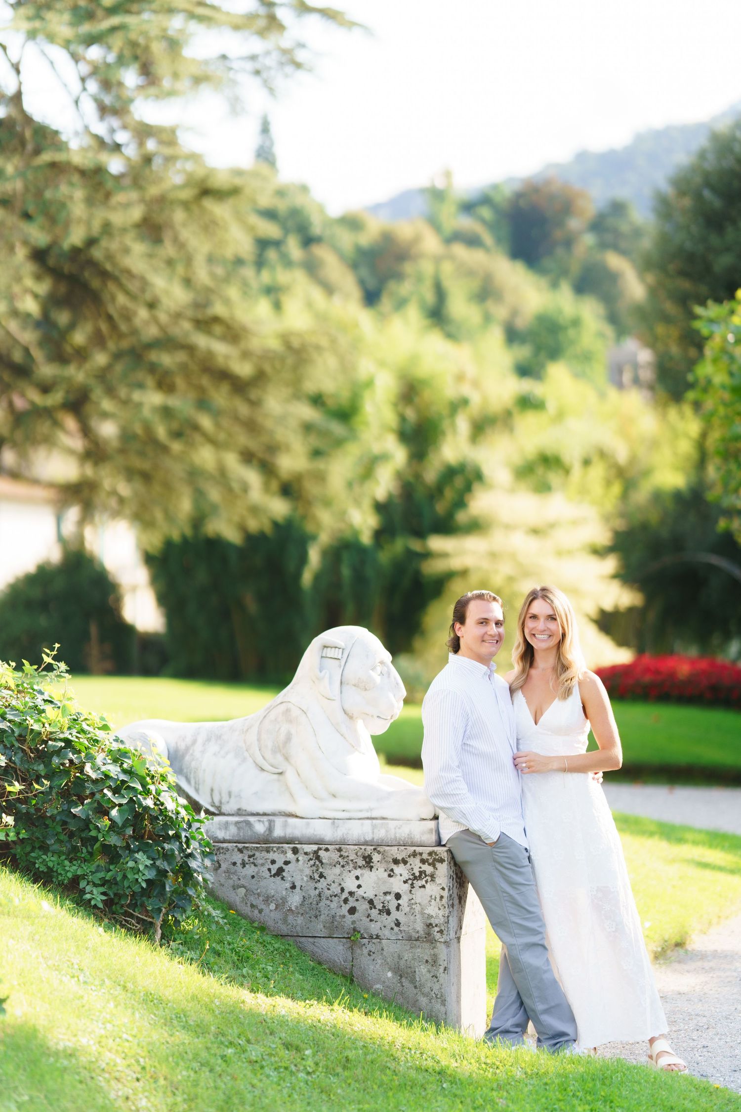 A romantic wedding photo sequence showing a couple posing together on a stone wall in a lush garden setting.