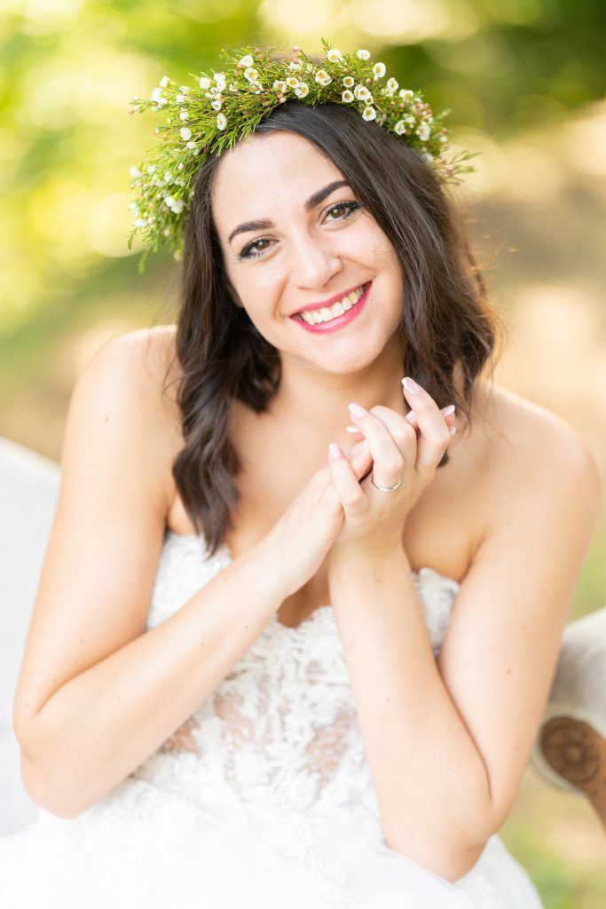 Bridal portrait series with delicate flower crown in soft natural lighting.