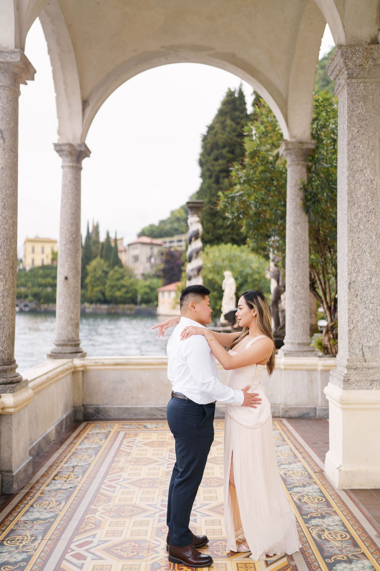 Lake Como proposal photographer capturing surprise engagement at Villa Monastero in Varenna