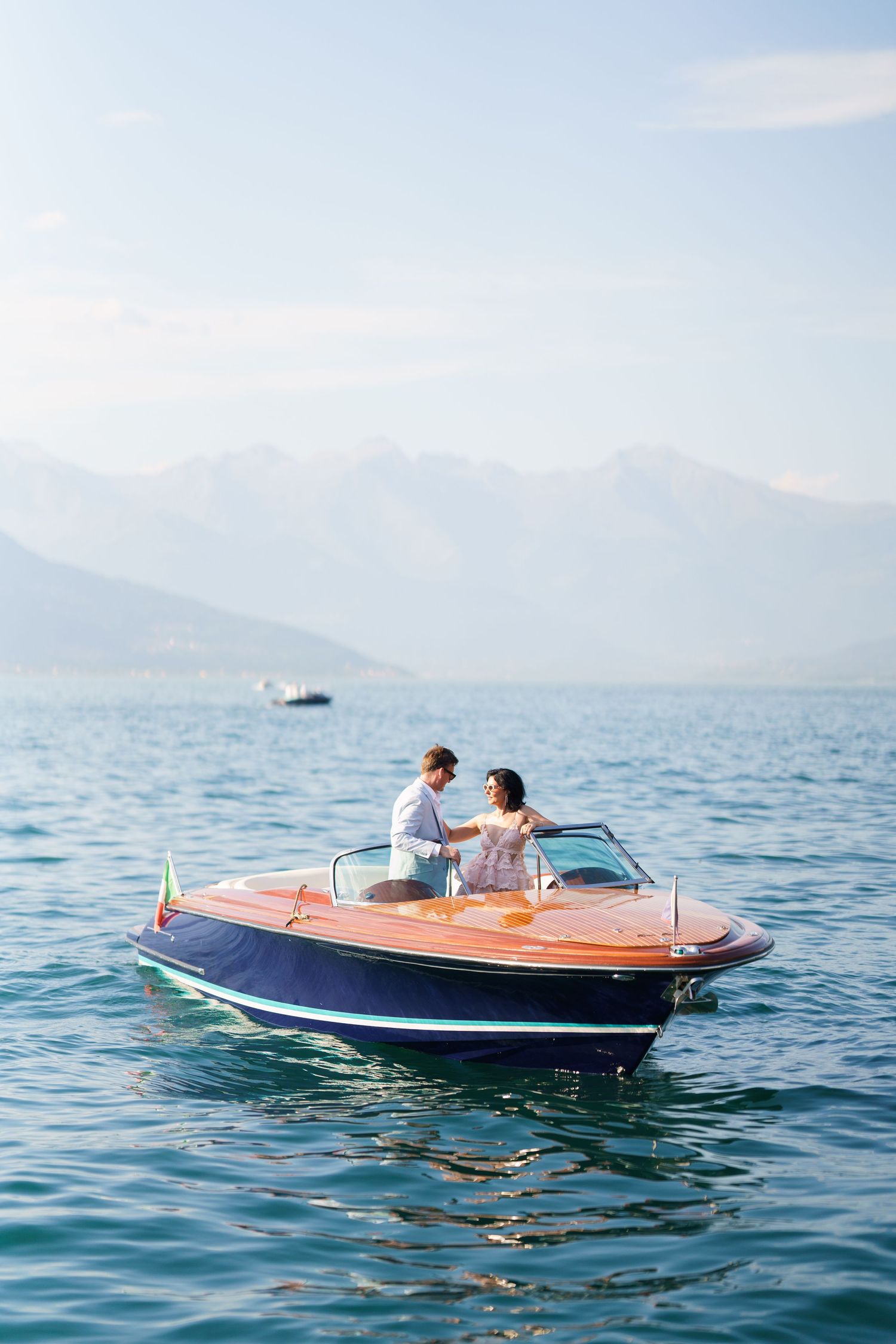 luxury lake como photoshoot with classic wooden boat