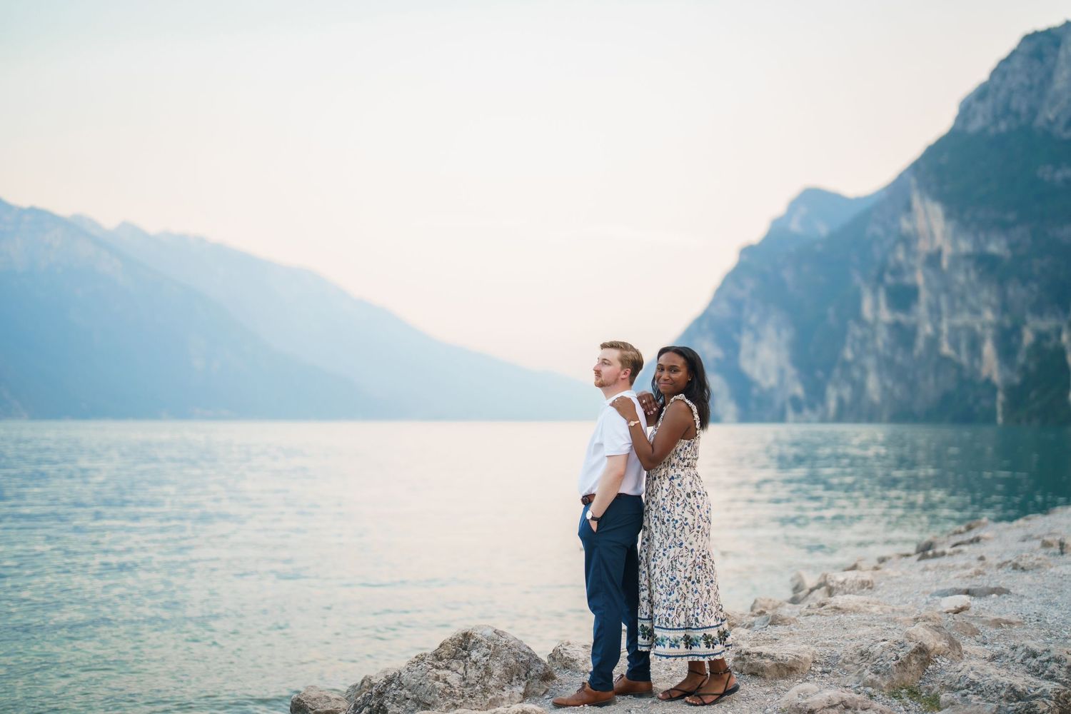 Emotional reaction during a surprise proposal beside Lake Garda in Riva del Garda