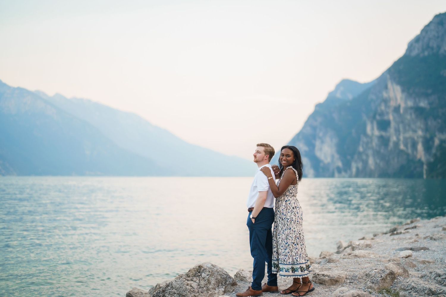 Emotional reaction during a surprise proposal beside Lake Garda in Riva del Garda
