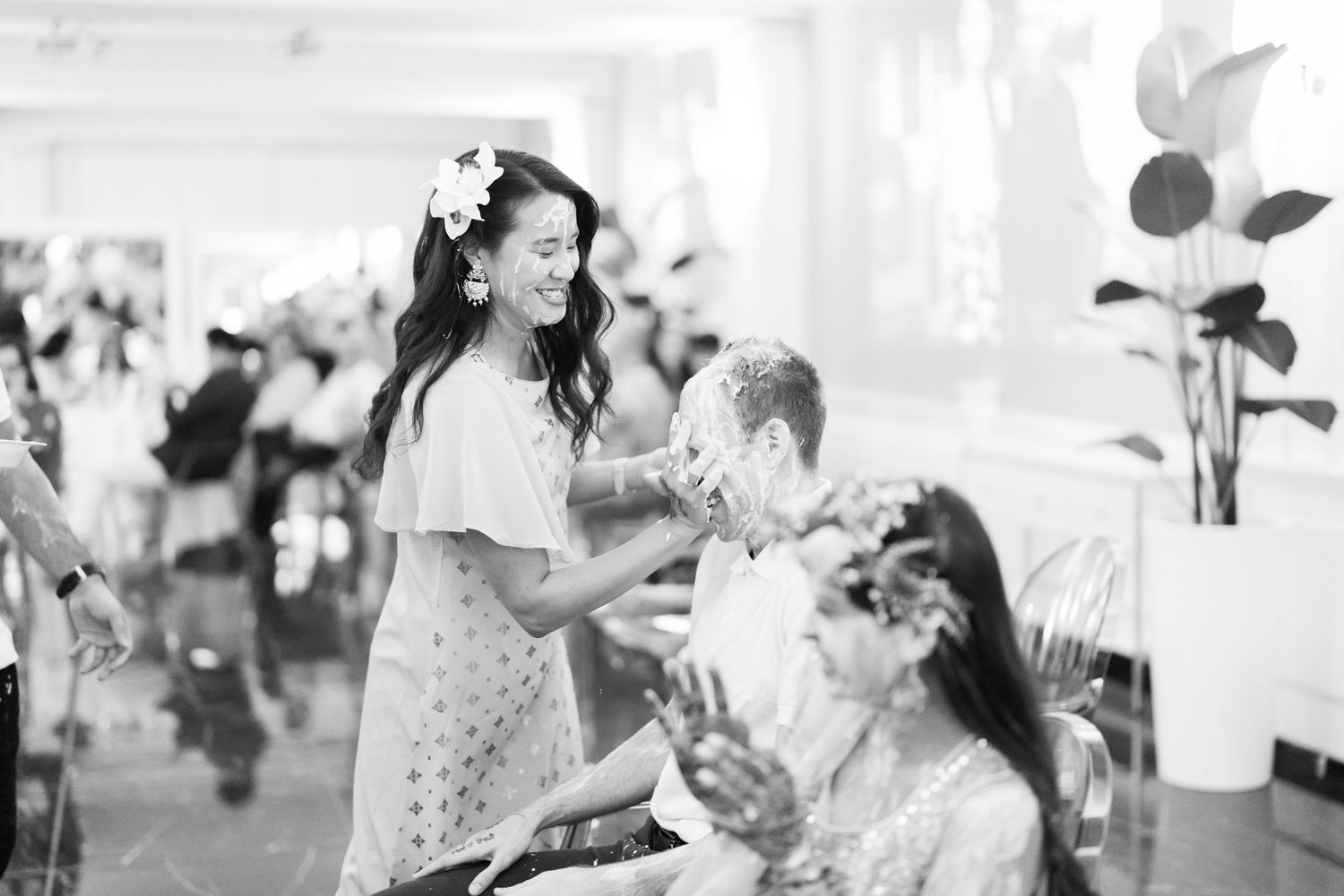 Black and white photographs showing candid moments of celebration and laughter.
