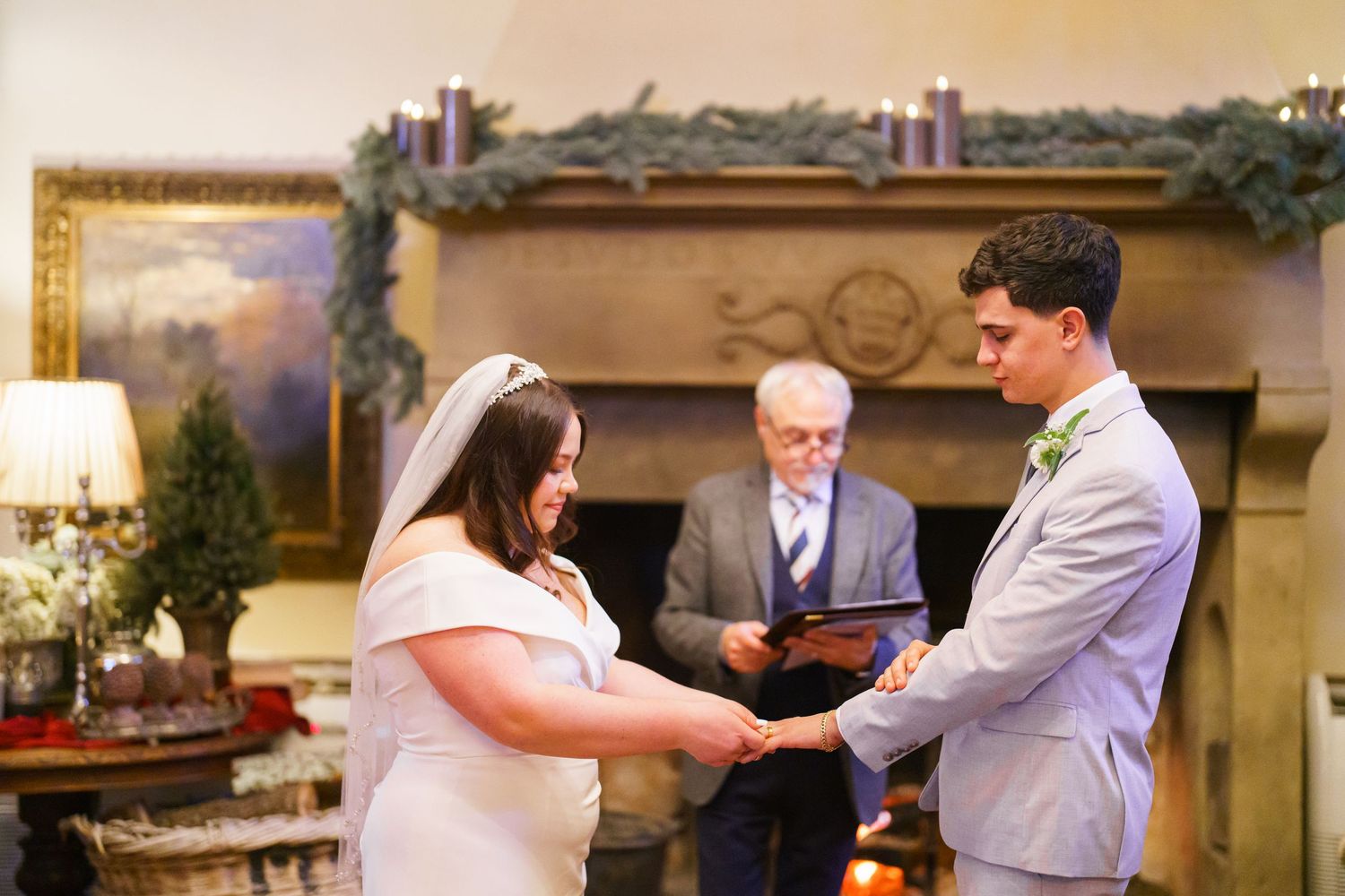 Wedding celebration with guests dancing in an elegant indoor venue.