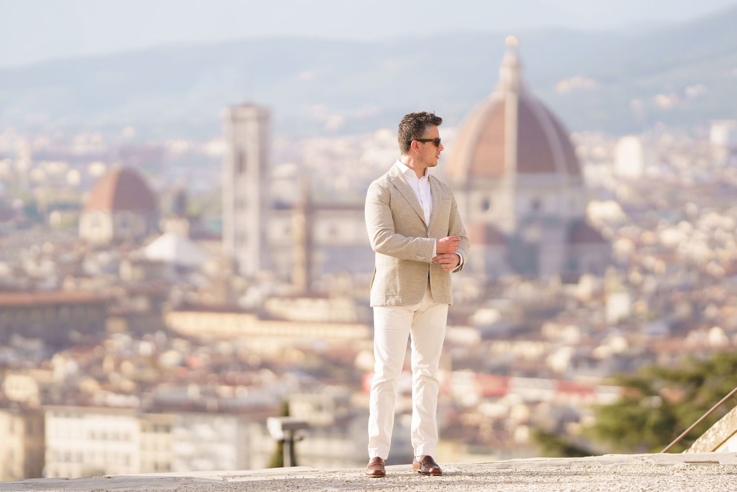 Scenic panoramic view of Florence, Italy with the iconic Duomo cathedral dome rising above the cityscape.