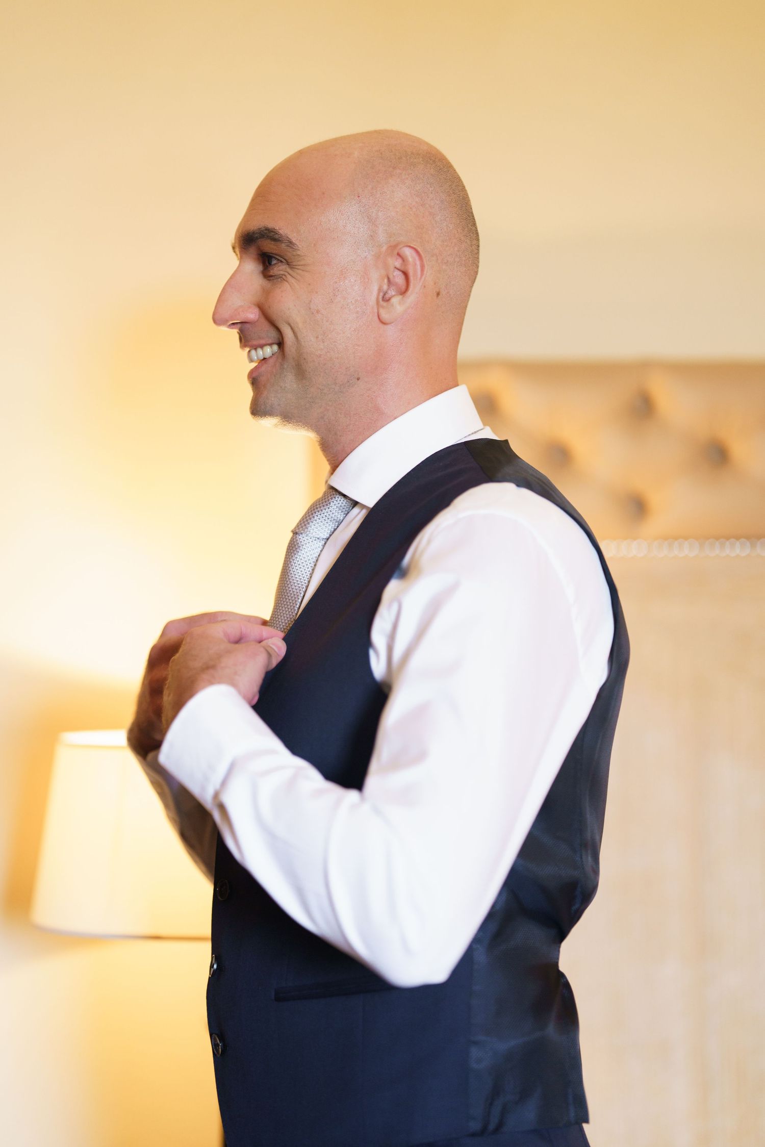 Man adjusting formal attire and tie in sequence of preparation shots.