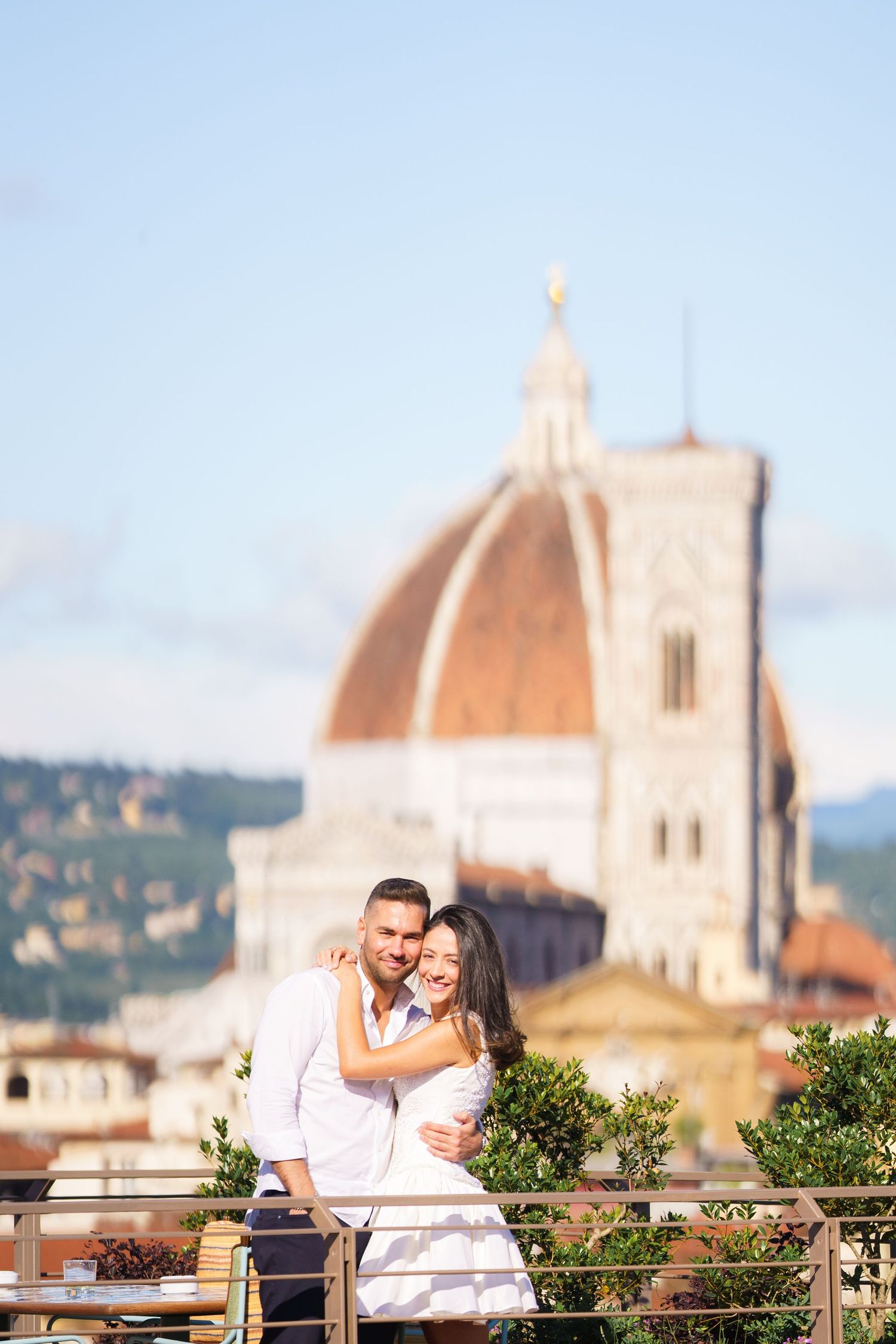 Couple sharing tender moments against the backdrop of Florence's historic cathedral and cityscape.