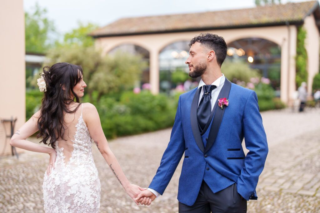 Candid wedding photography session against the backdrop of a rustic Italian villa.