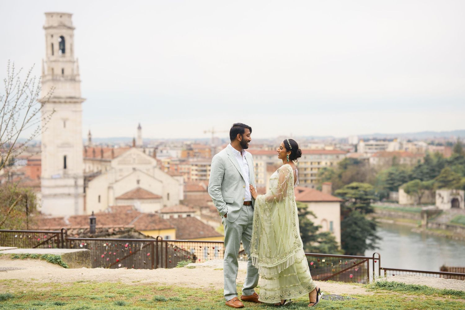 Two people in casual attire admire the historic architecture and scenic views of Florence, Italy from various vantage points.