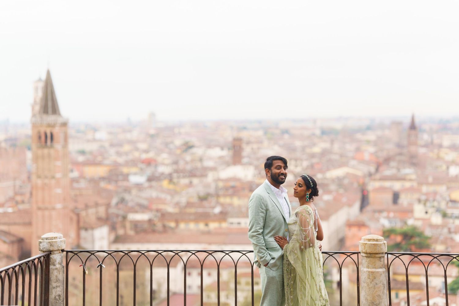 Couple shares romantic moments overlooking the scenic cityscape of Florence, Italy from various hilltop viewpoints.