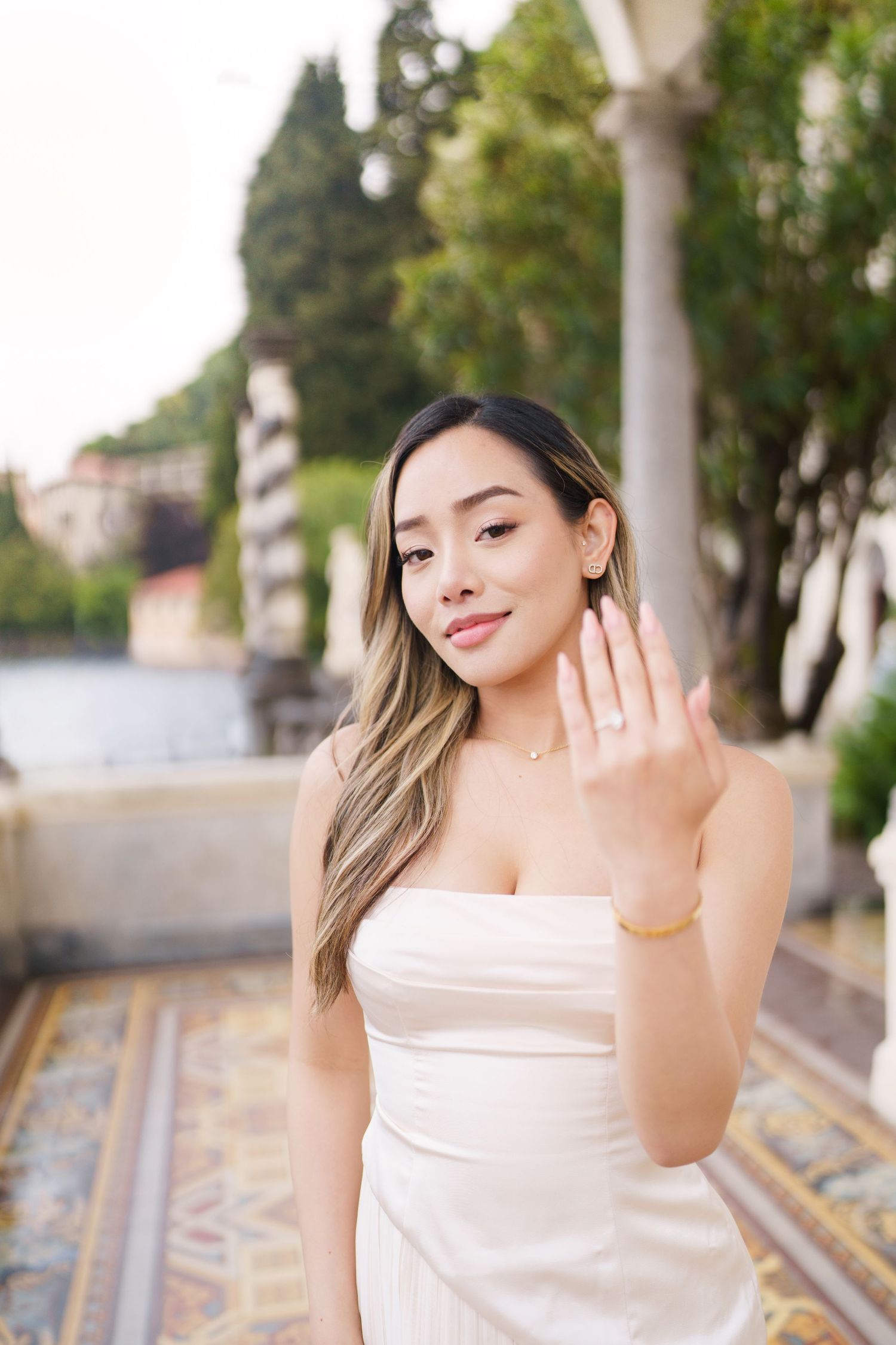 Lake Como proposal photographer capturing surprise engagement at Villa Monastero in Varenna