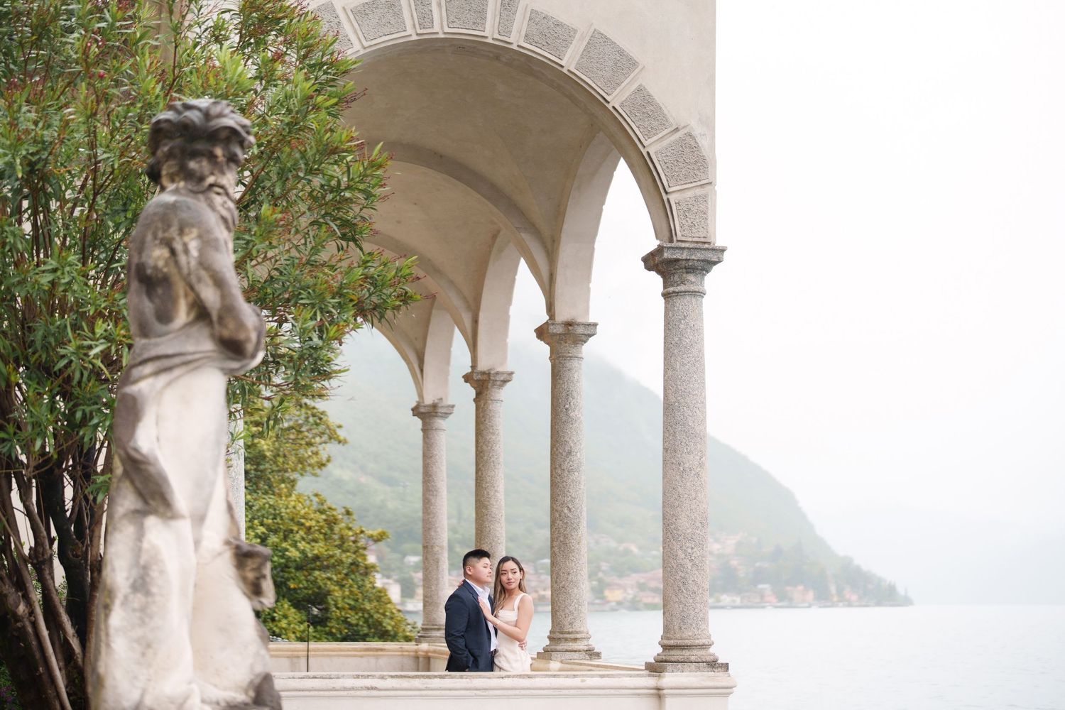 Lake Como proposal photographer capturing surprise engagement at Villa Monastero in Varenna