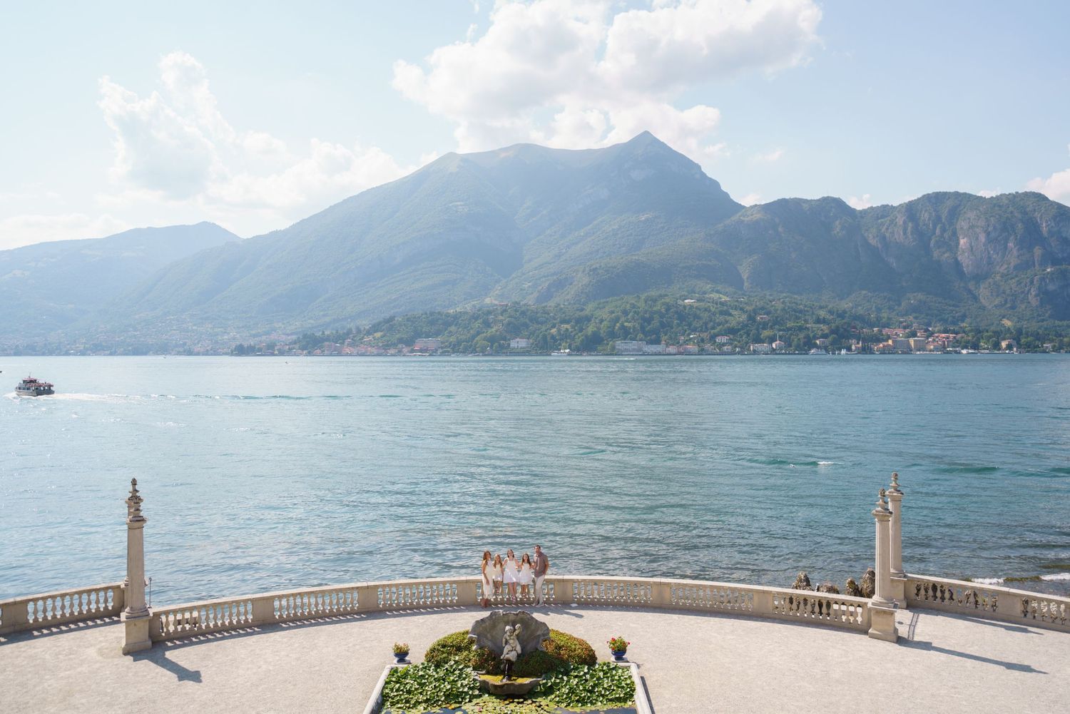 Family portrait at Villa Melzi with Lake Como mountains in Bellagio