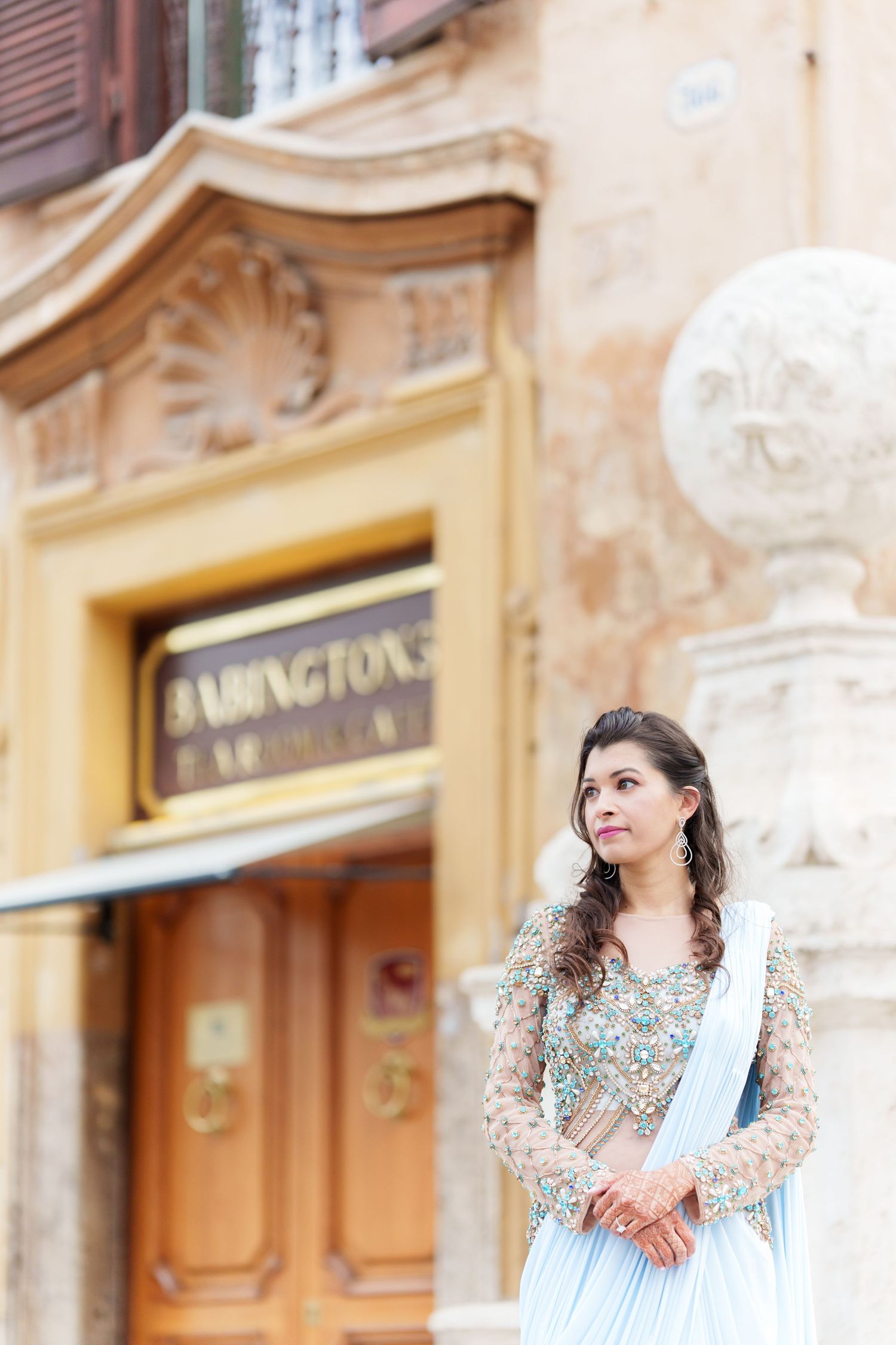 Elegant historic building facade with ornate architectural details and golden signage.