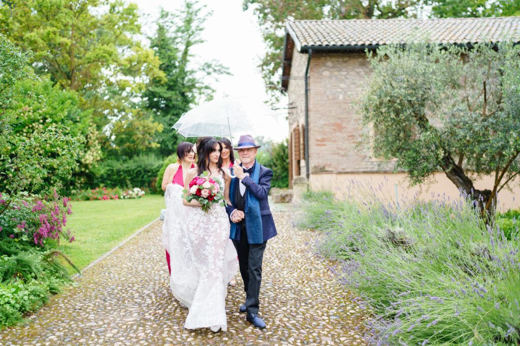 Elegant wedding photos captured in a rustic garden setting with stone paths and greenery.