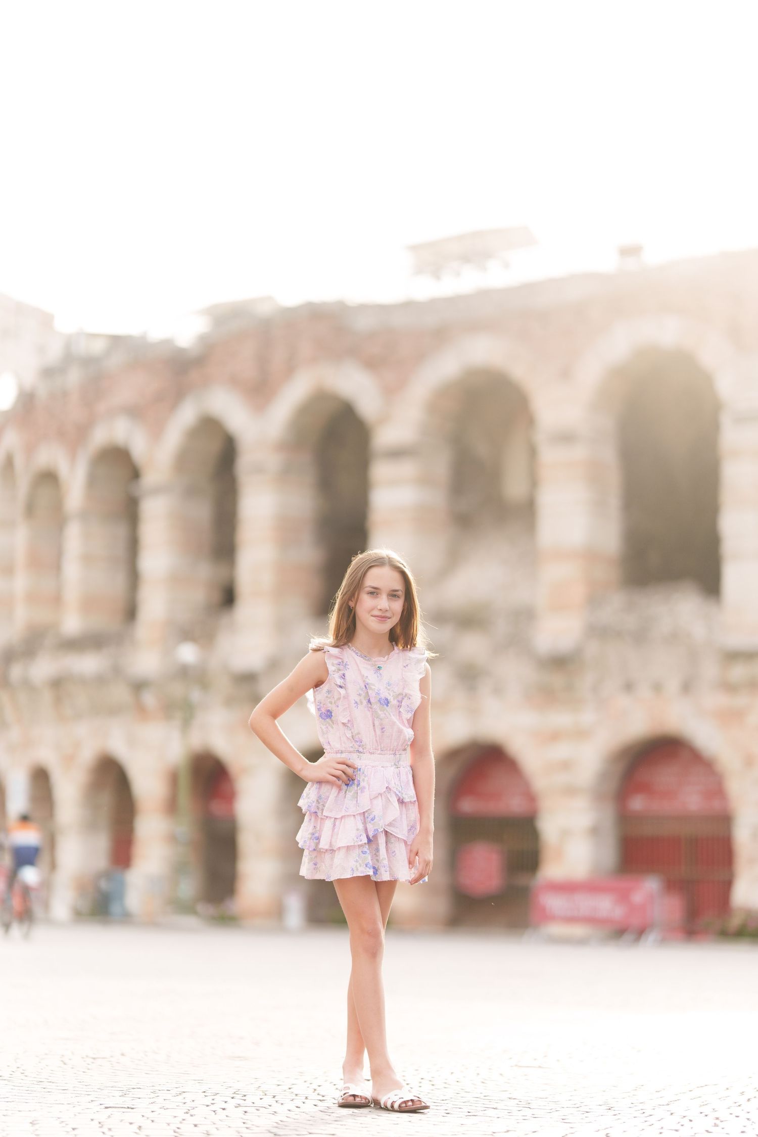 Verona family photographer family walking in front of Verona Arena Italy