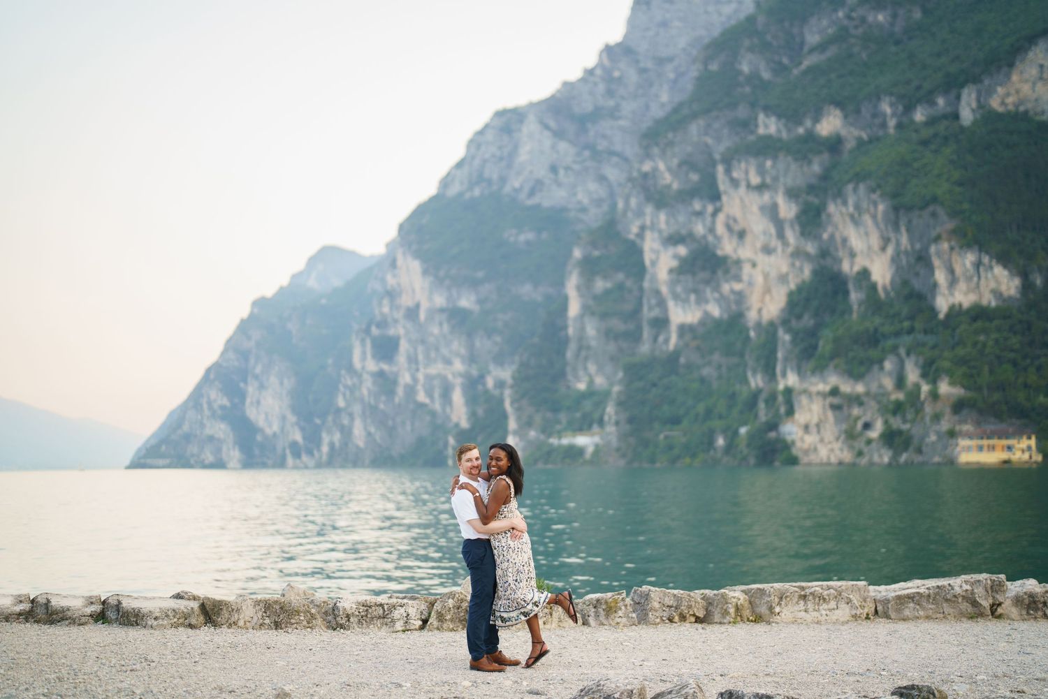 Emotional reaction during a surprise proposal beside Lake Garda in Riva del Garda