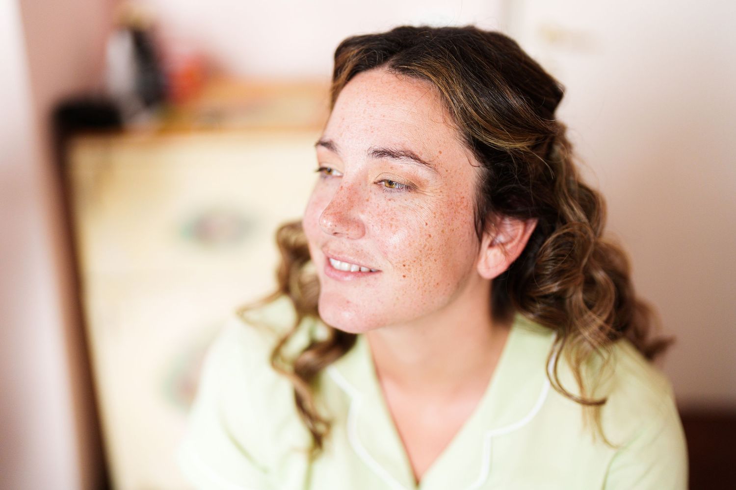 Candid portrait shots showing joyful expressions against a light background.