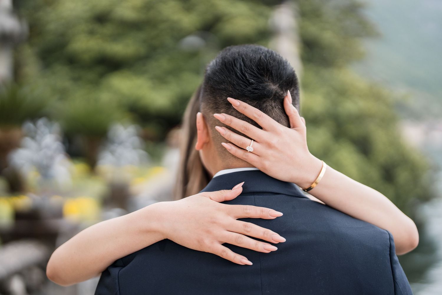 Lake Como proposal photographer capturing surprise engagement at Villa Monastero in Varenna