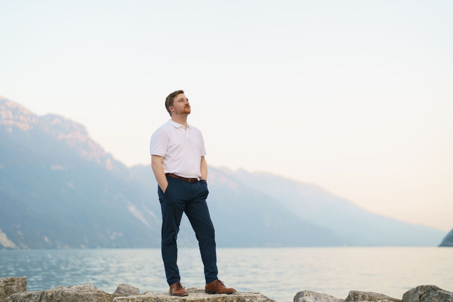 Emotional reaction during a surprise proposal beside Lake Garda in Riva del Garda