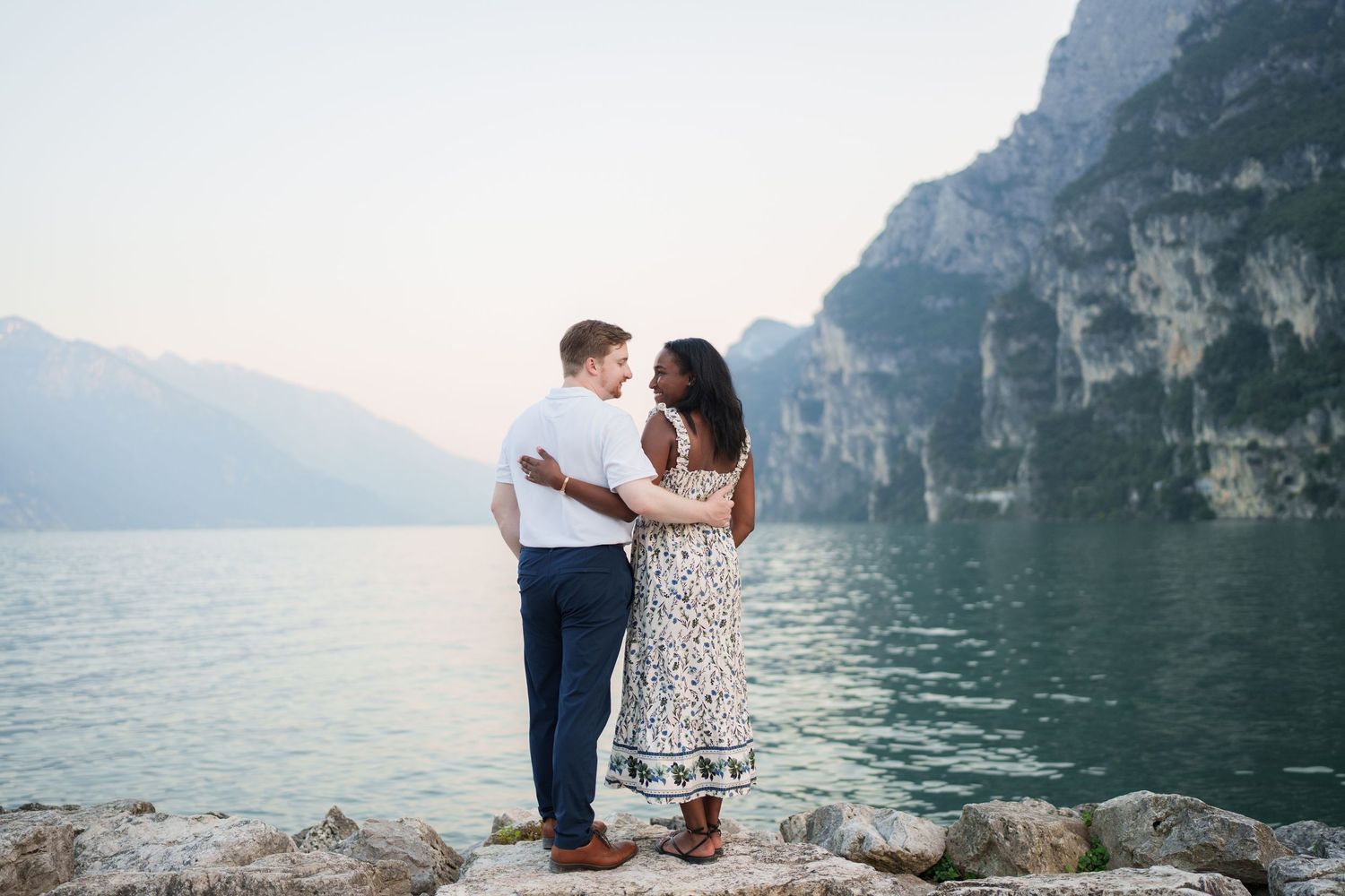 Emotional reaction during a surprise proposal beside Lake Garda in Riva del Garda
