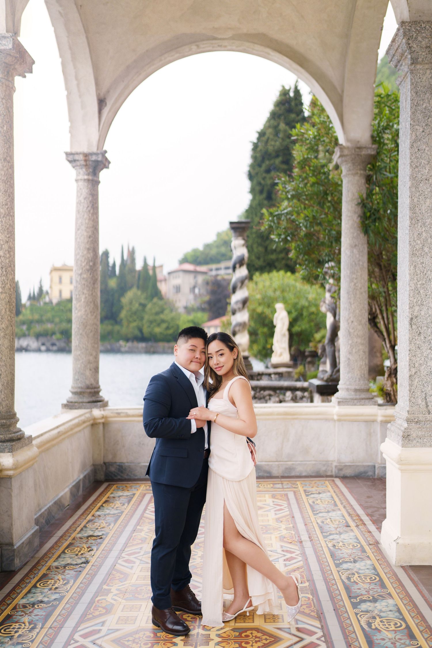 Lake Como proposal photographer capturing surprise engagement at Villa Monastero in Varenna