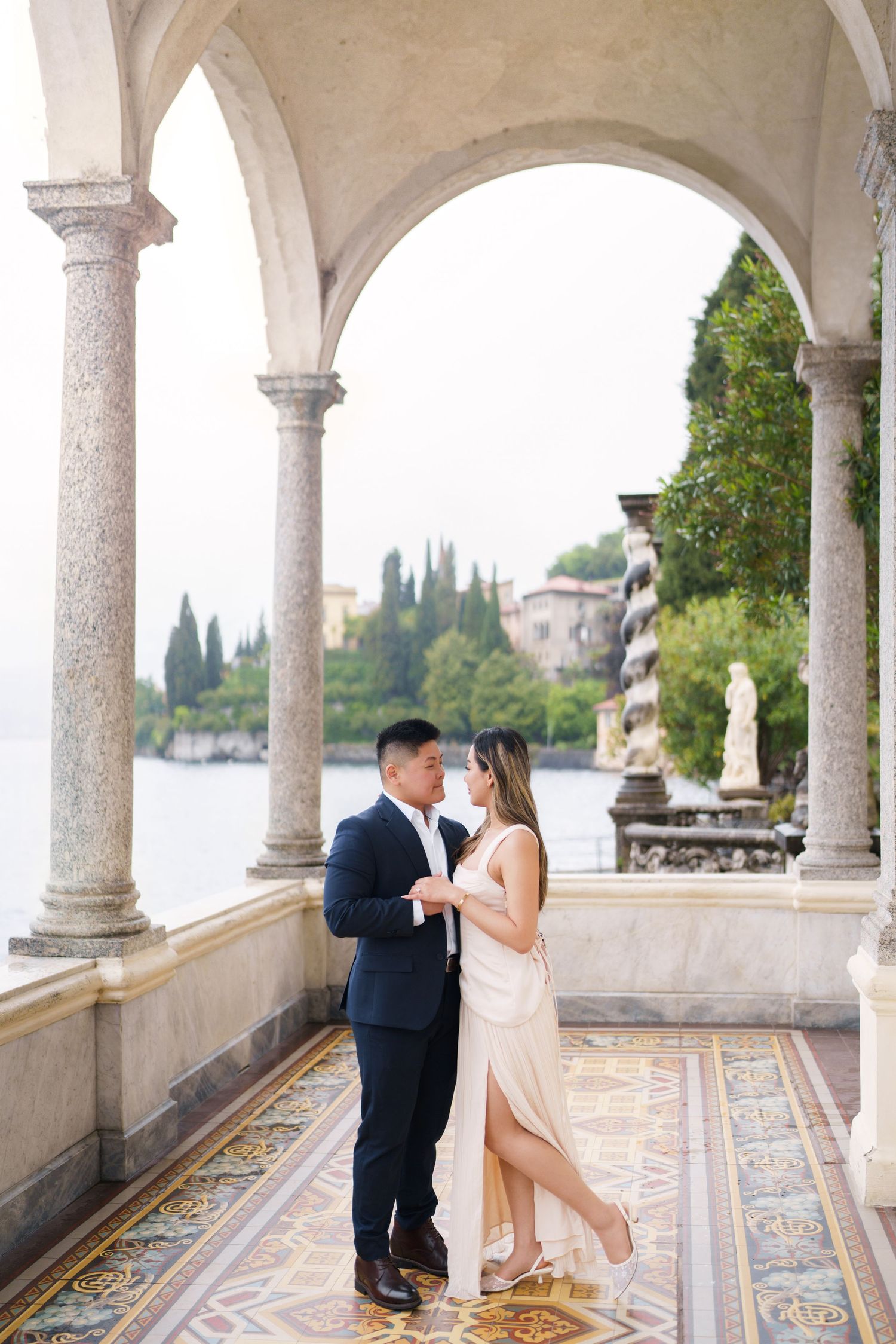 Lake Como proposal photographer capturing surprise engagement at Villa Monastero in Varenna
