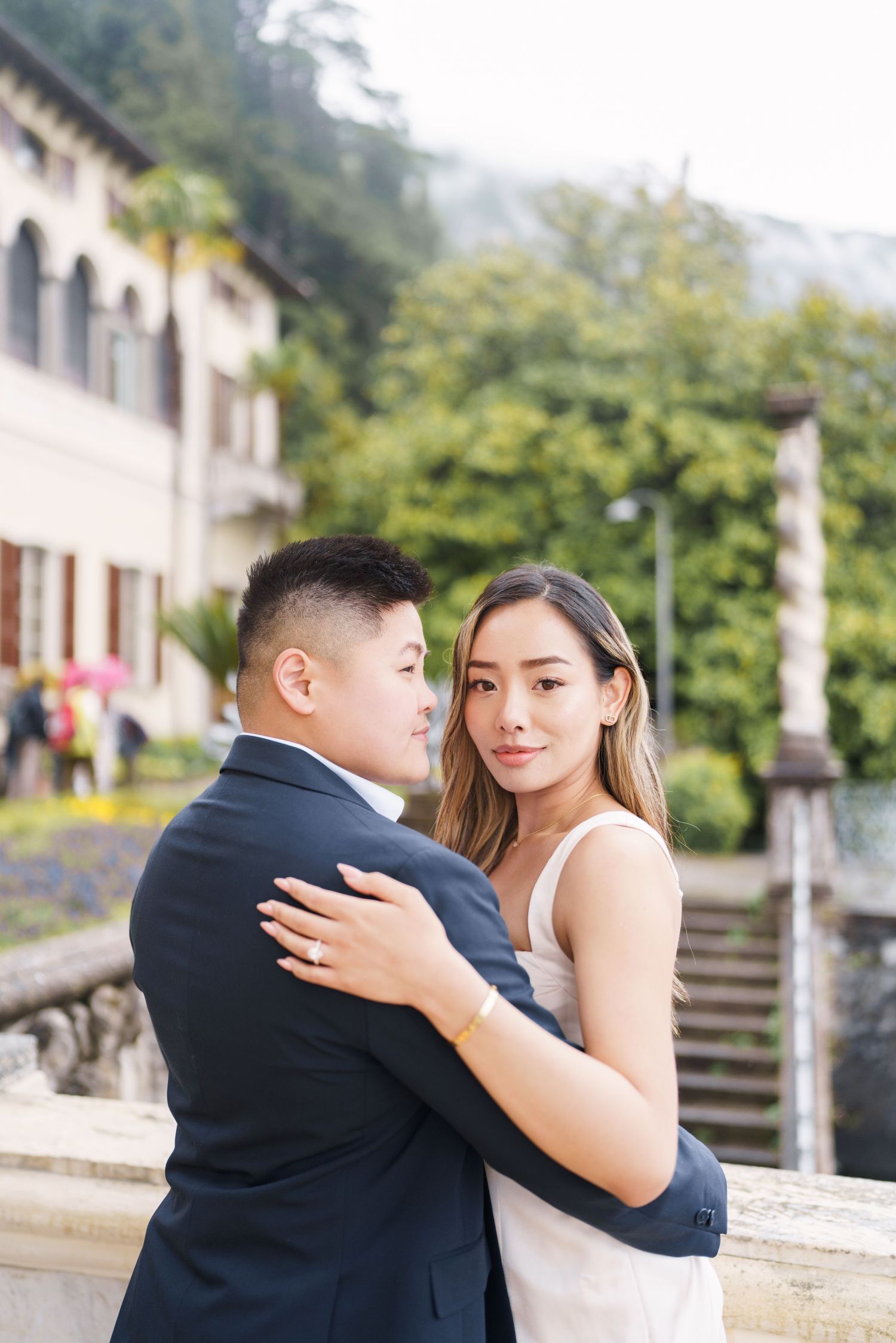 Lake Como proposal photographer capturing surprise engagement at Villa Monastero in Varenna