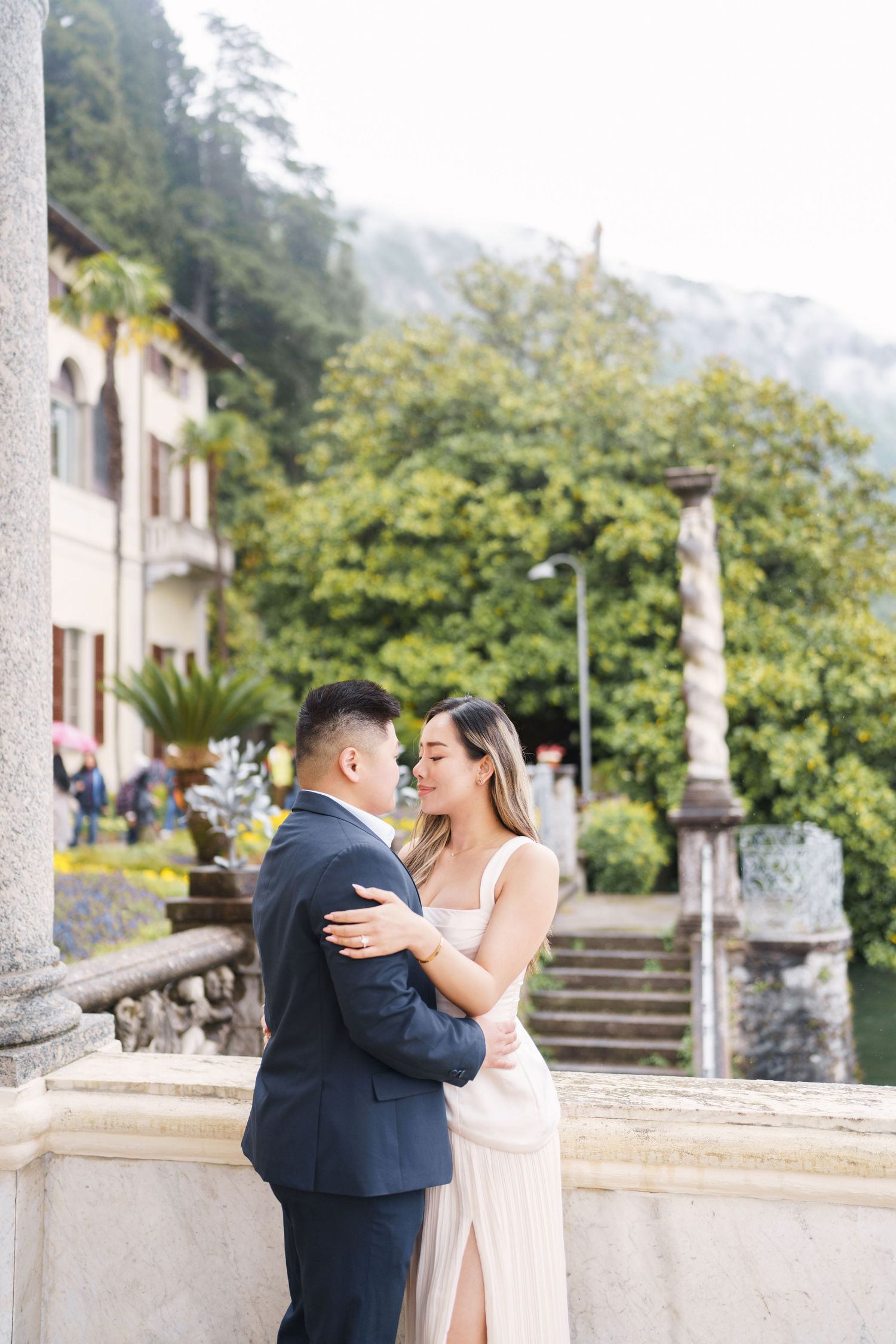 Lake Como proposal photographer capturing surprise engagement at Villa Monastero in Varenna