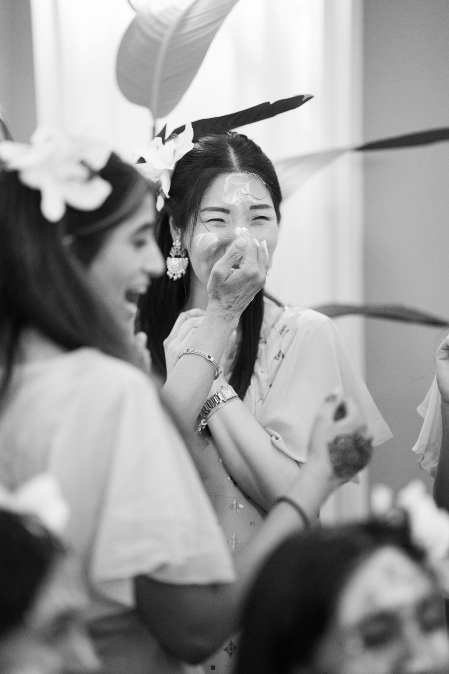 Black and white candid shots capturing genuine moments of happiness at a celebration.